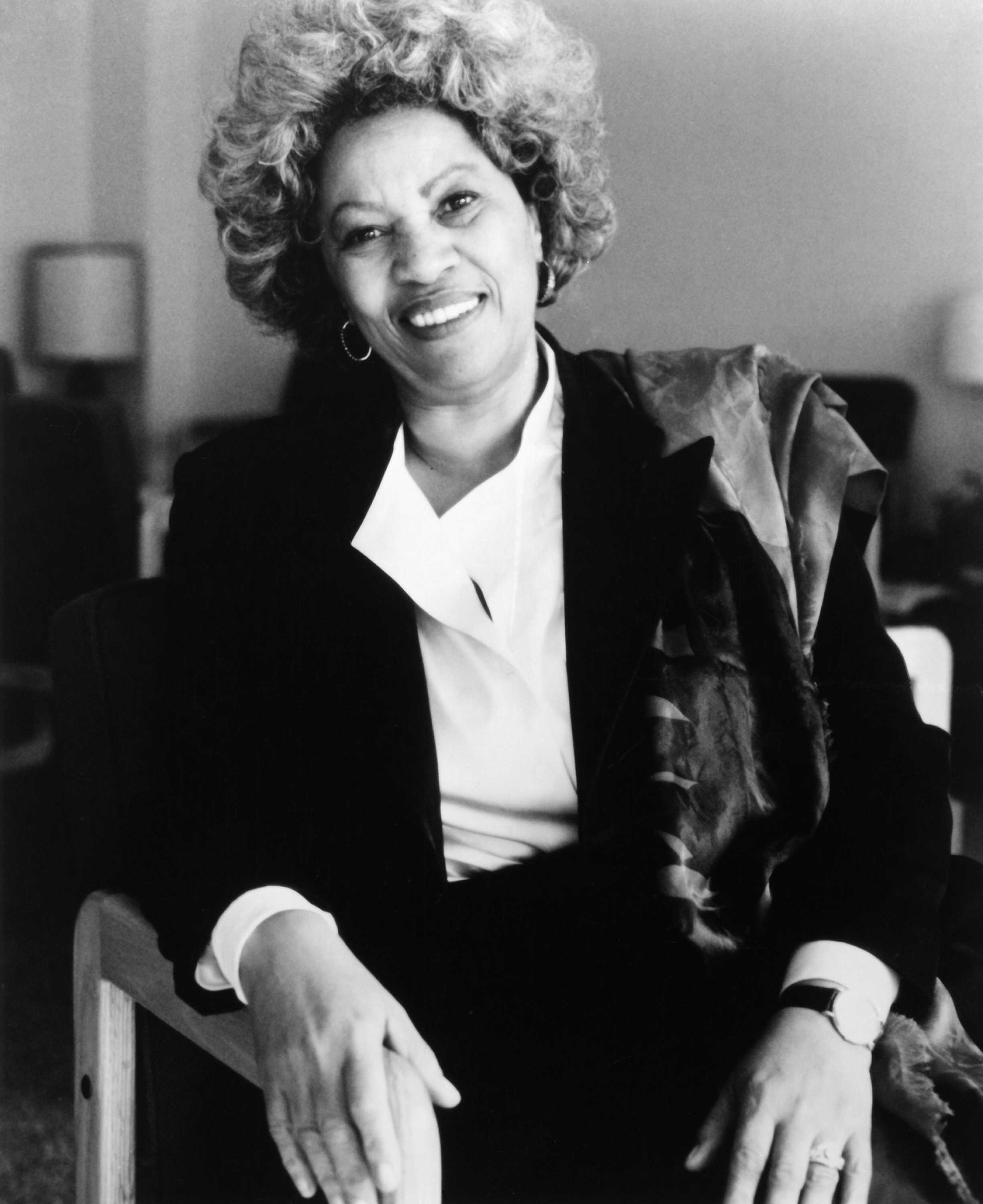 Black and white photograph of Toni Morrison seated in a chair