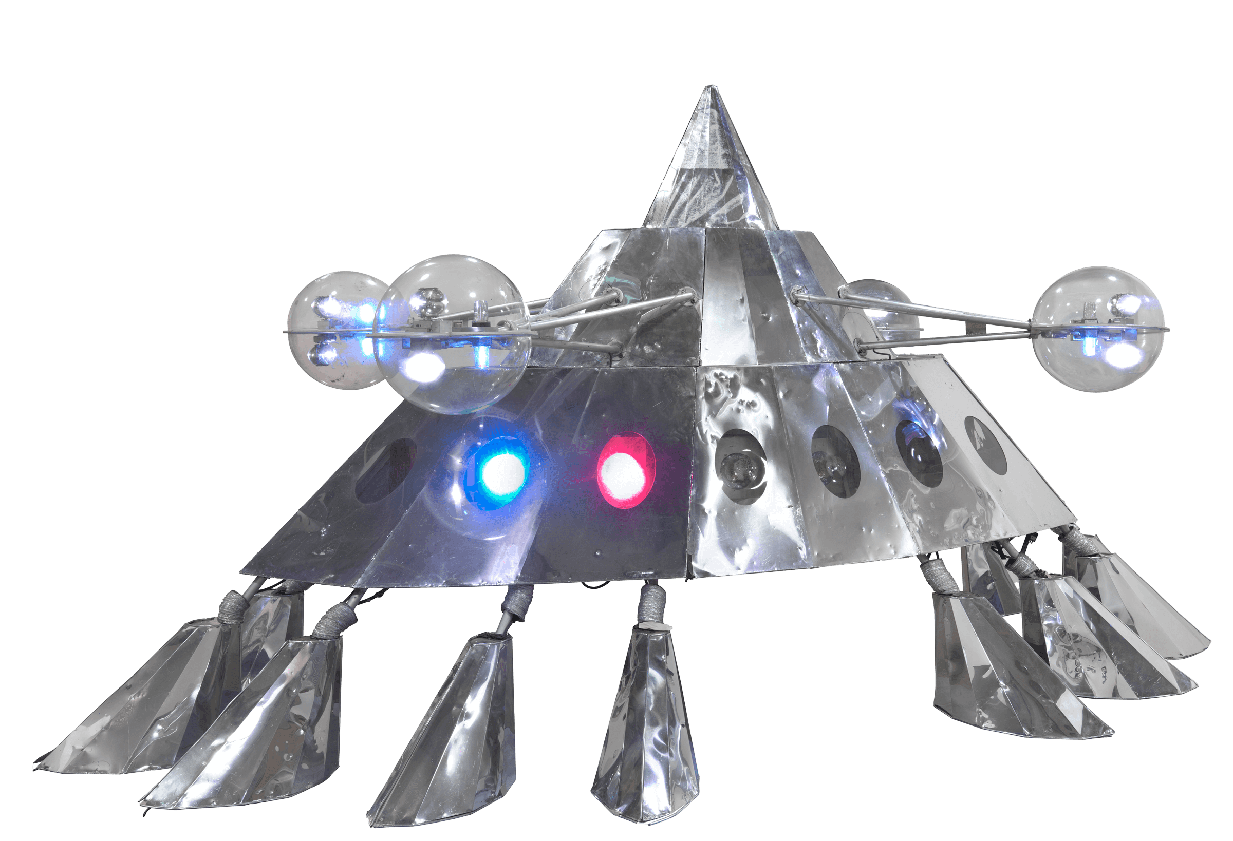 A sliver space vehicle with multiple legs and colored lights, replicating the originally Mothership.