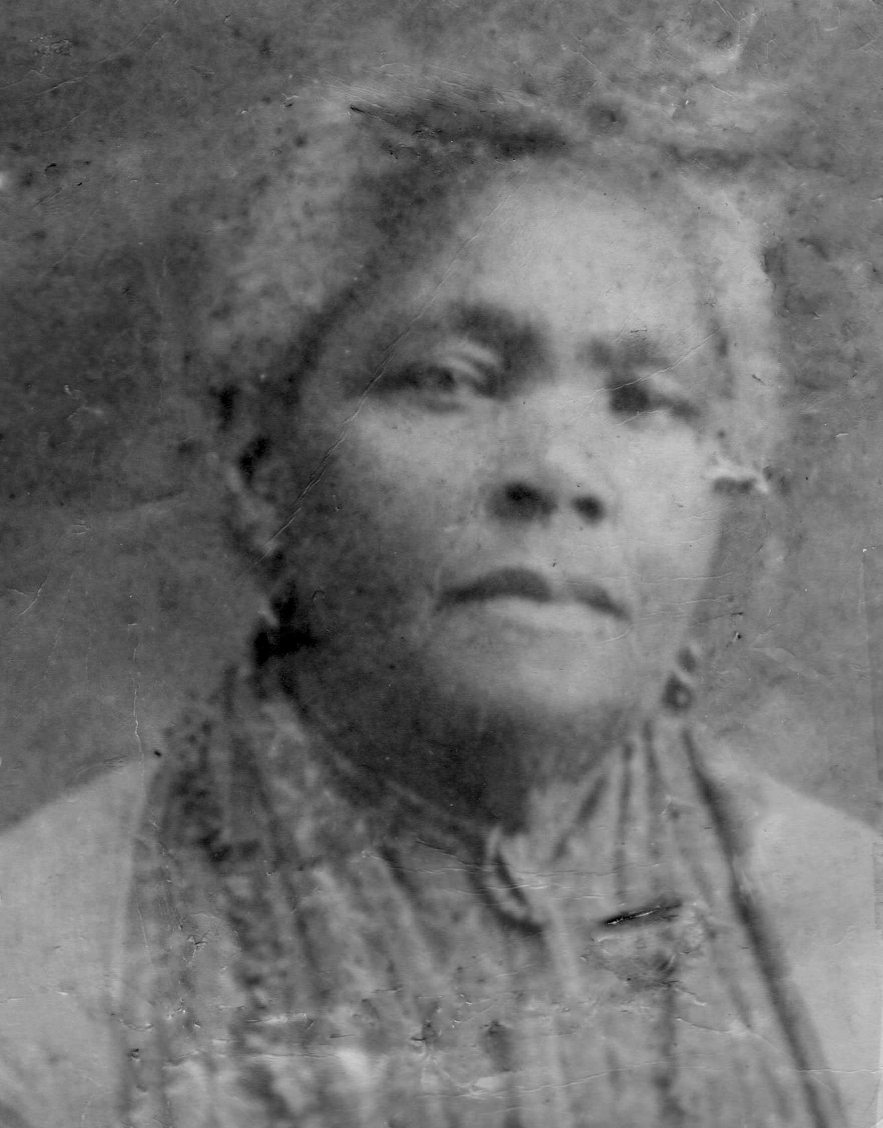 A blurry, close up portrait of Louvinia Price. The photo is labeled 'My grandmother' and 'My Father's Mother'