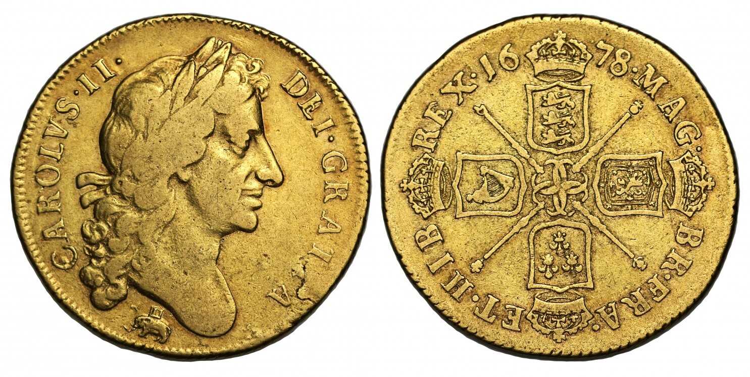 A front and back view of two guinea gold coins with a side profile of a person on one side and emblem on the other.