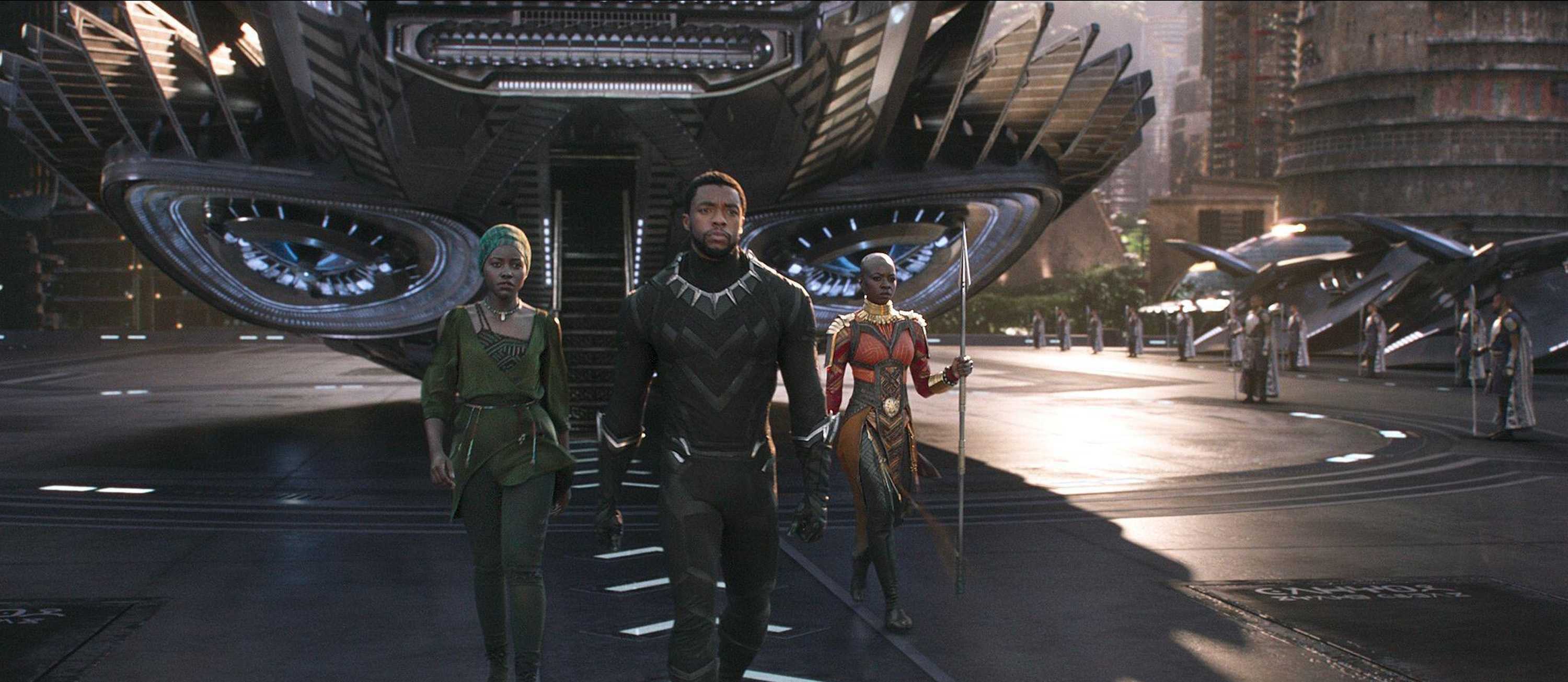T’Challa, Okoye, and Nakia walking off their ship, coming back from saving Nakia.