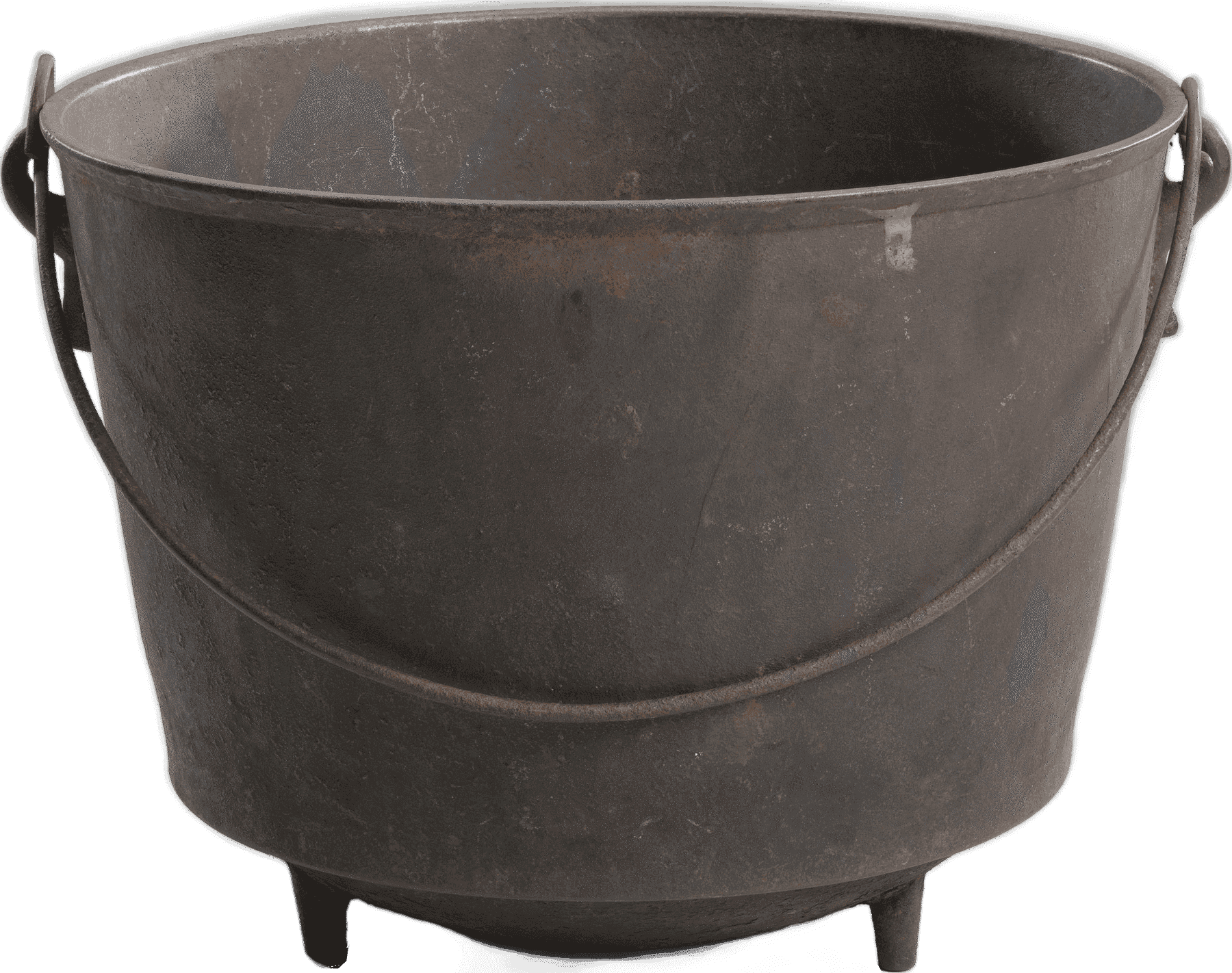 Iron kettle with three feet and a swinging handle.