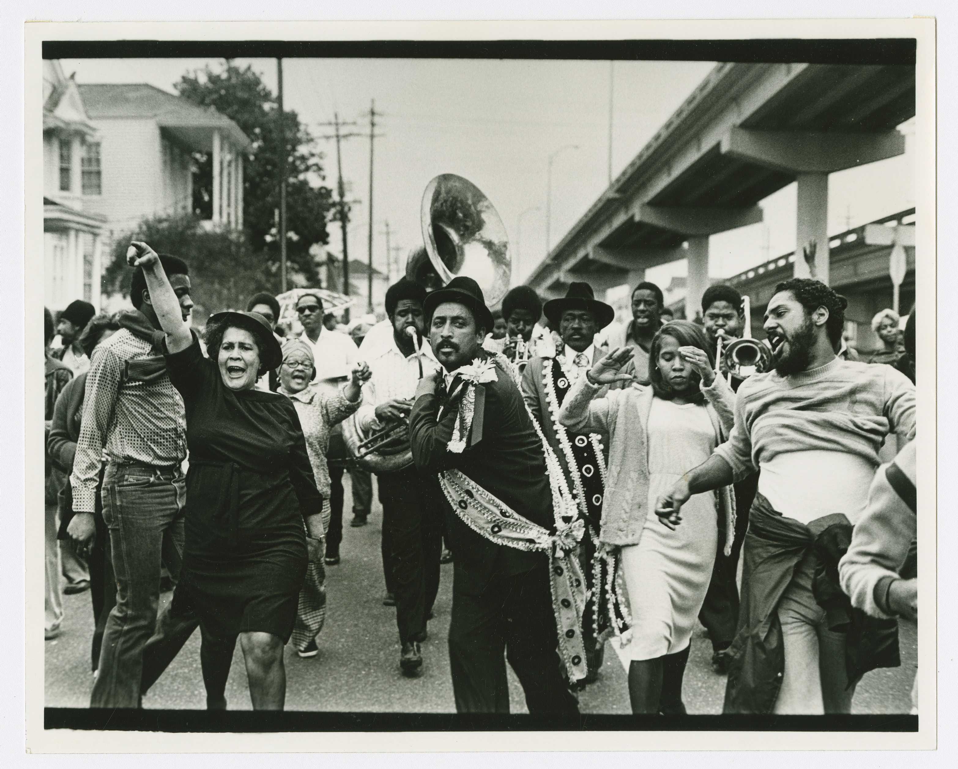 Black and white photograph of jazz funeral in New Orleans.