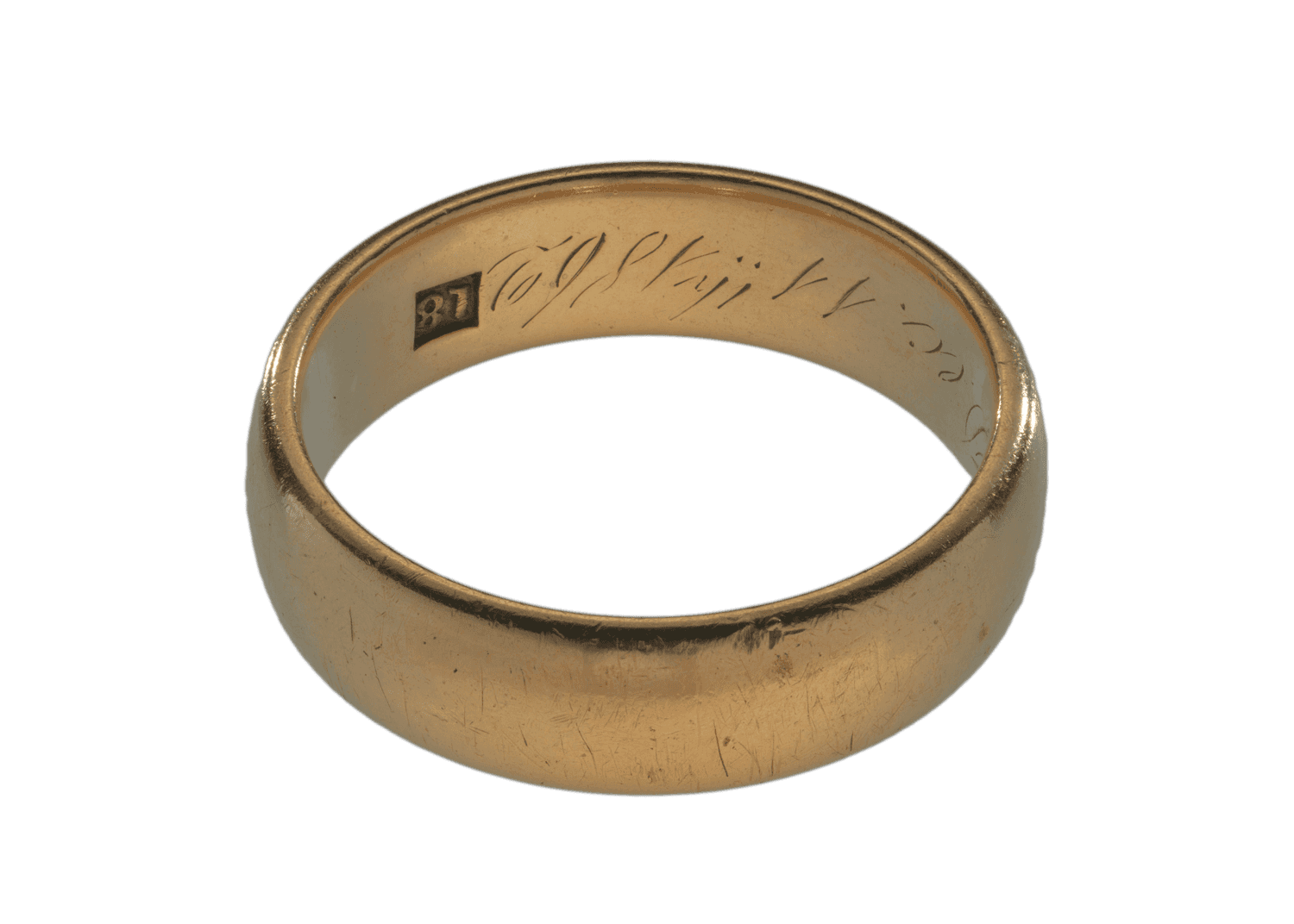 A simple gold ring with some writing inside. The ring is slightly worn and scratched.