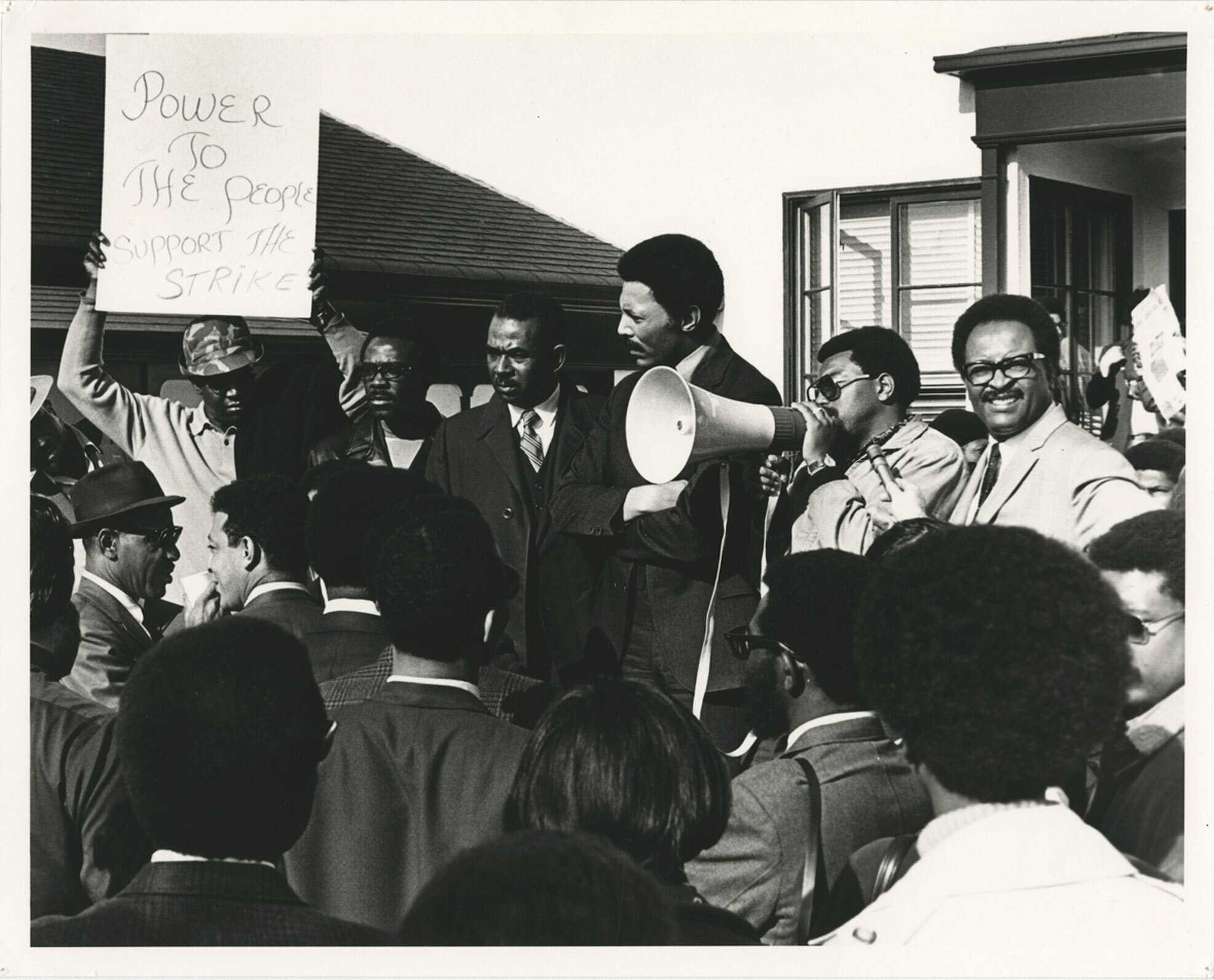 Protesters with bullhorn and sign that reads, "Power to the people -- support the strike," San Francisco State College strike