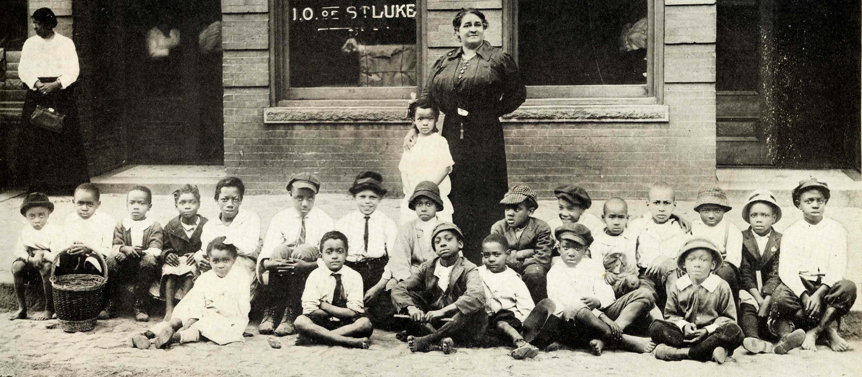 Photograph of Maggie L. Walker with neighborhood children