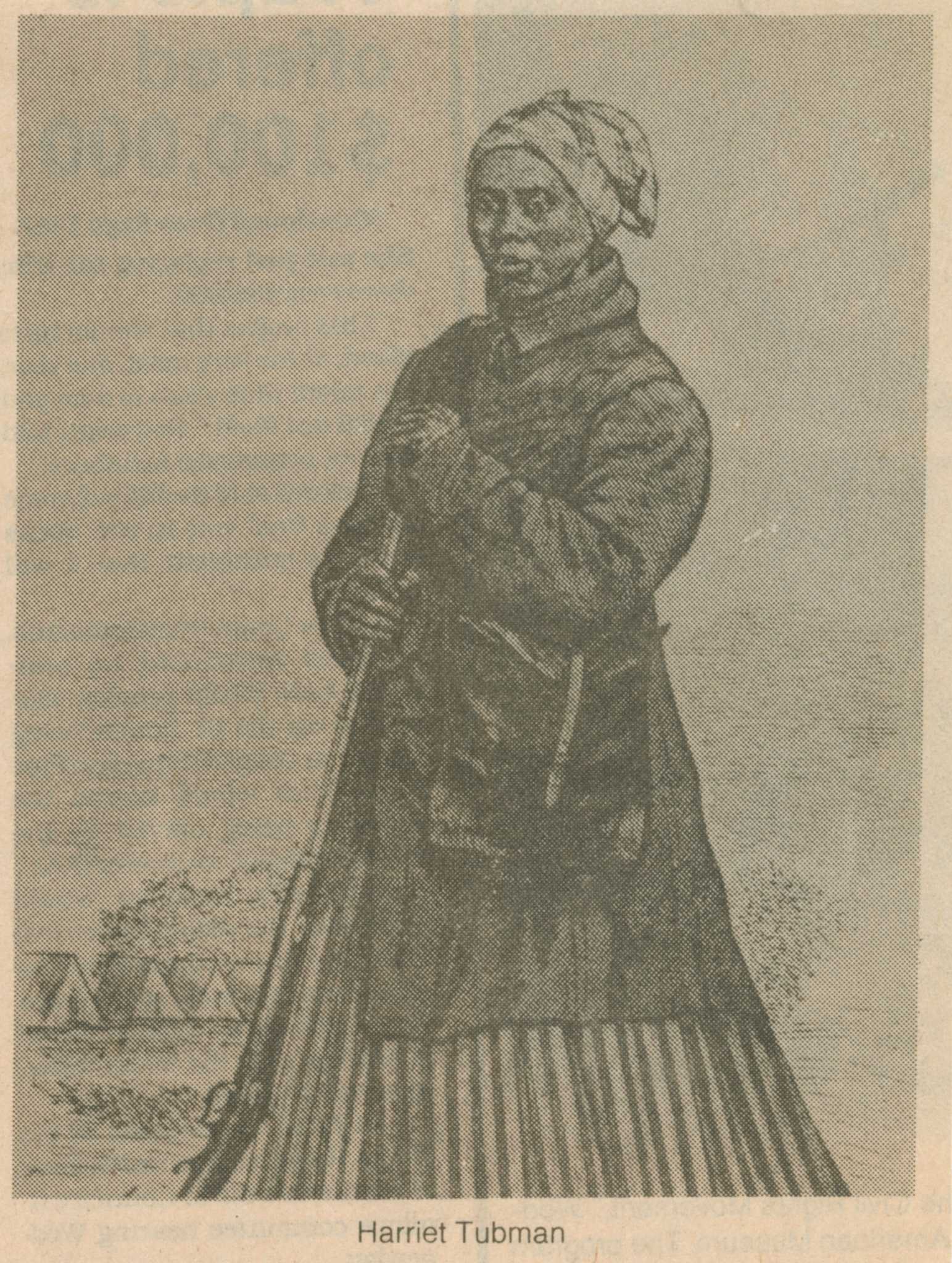 A clipping from The Philadelphia Tribune featuring a reproduction of John G. Darby's woodcut engraving portrait of Harriet Tubman. The image has been cropped from the original full-length portrait which depicts Tubman standing, holding a rifle with Civil War tents in the background. The clipping cuts off the portrait just above the feet. Above is the first two columns of the accompanying article with the headline "Spoken history: / Harriet Tubman" and beneath is the caption [Harriet Tubman]. The clipping refers to a Women's History Month program at the African American Museum in Philadelphia featuring Tubman's great-grandniece Mariline Wilkins. The date and source are printed across the top [Friday, March 21, 1986 The Philadelphia Tribune].
