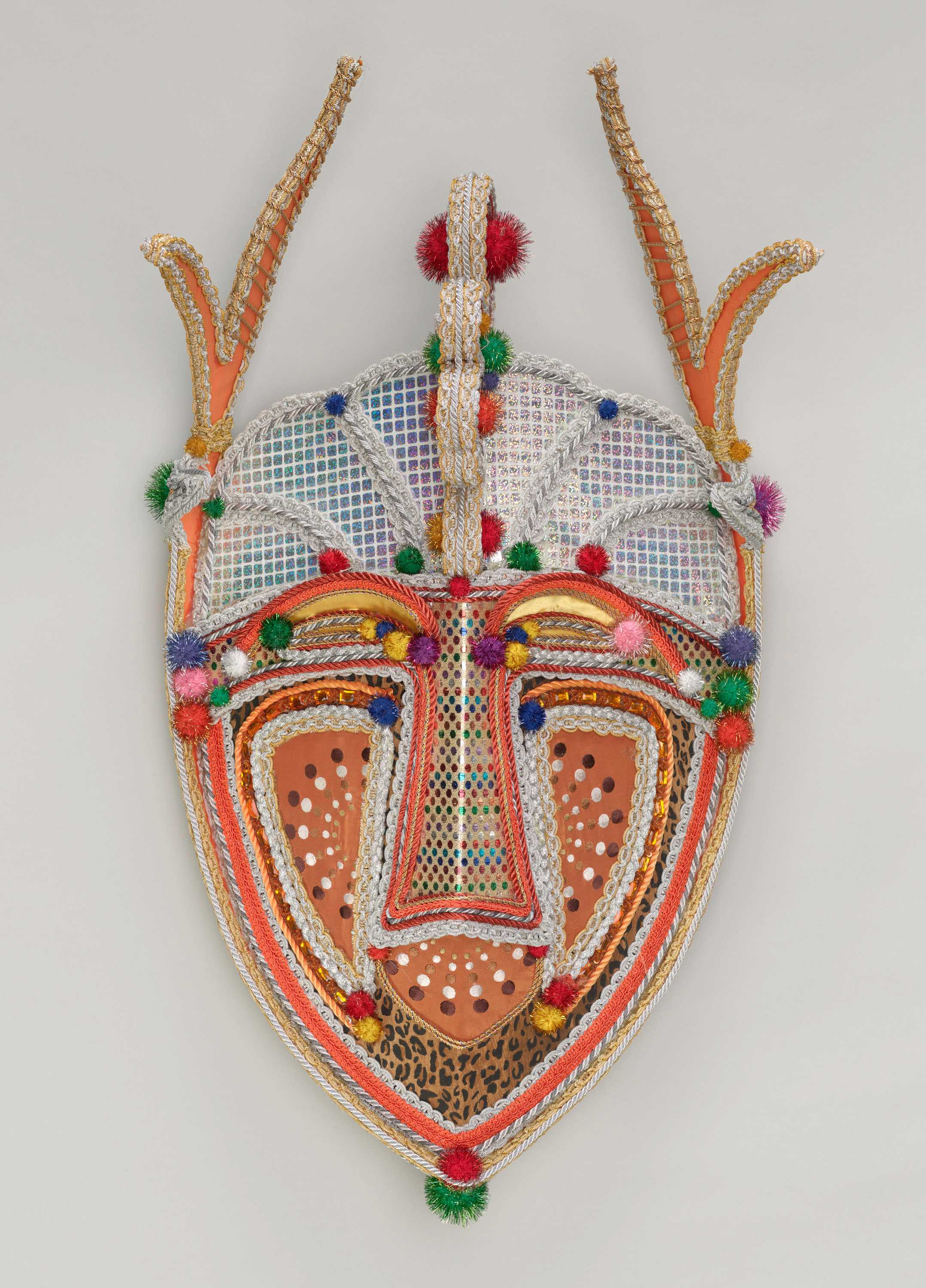 A mask shaped sign used in a Black Men of Labor parade in New Orleans.