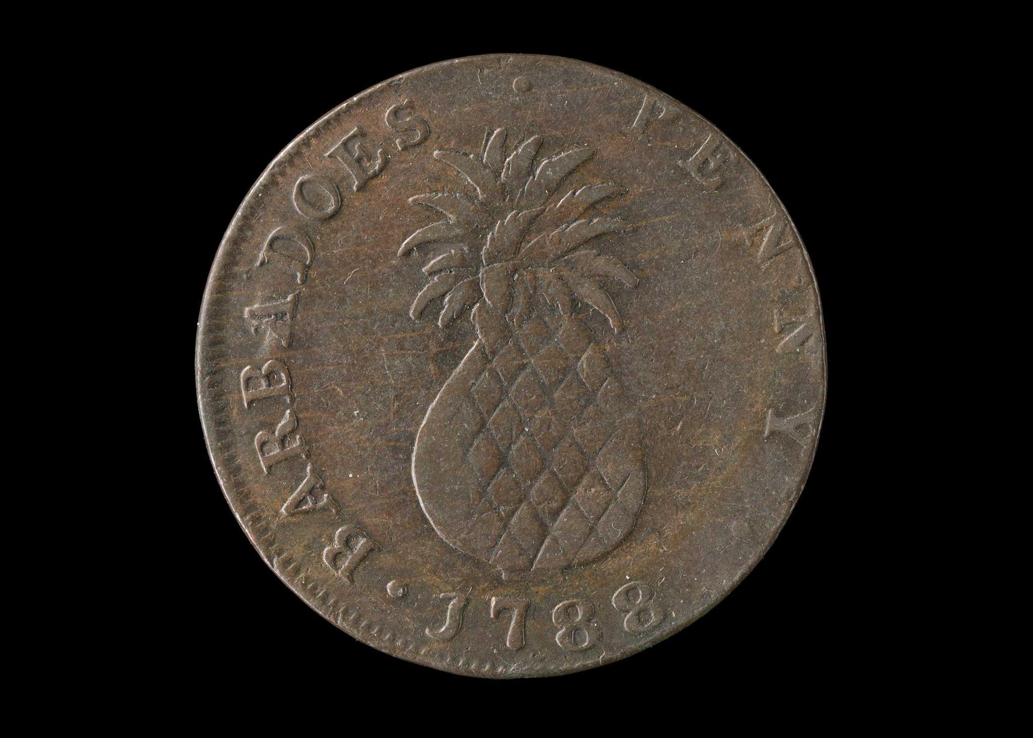 Barbados penny from 1788. One side of the coin shows an African figure in profile wearing a plumed crown with [I ∙ SERVE] at the bottom. The other side depicts a large pineapple. Around the border [BARBADOES [sic] ∙ PENNY ∙ 1788] is in raised relief. The coin is tarnished and shows wear.