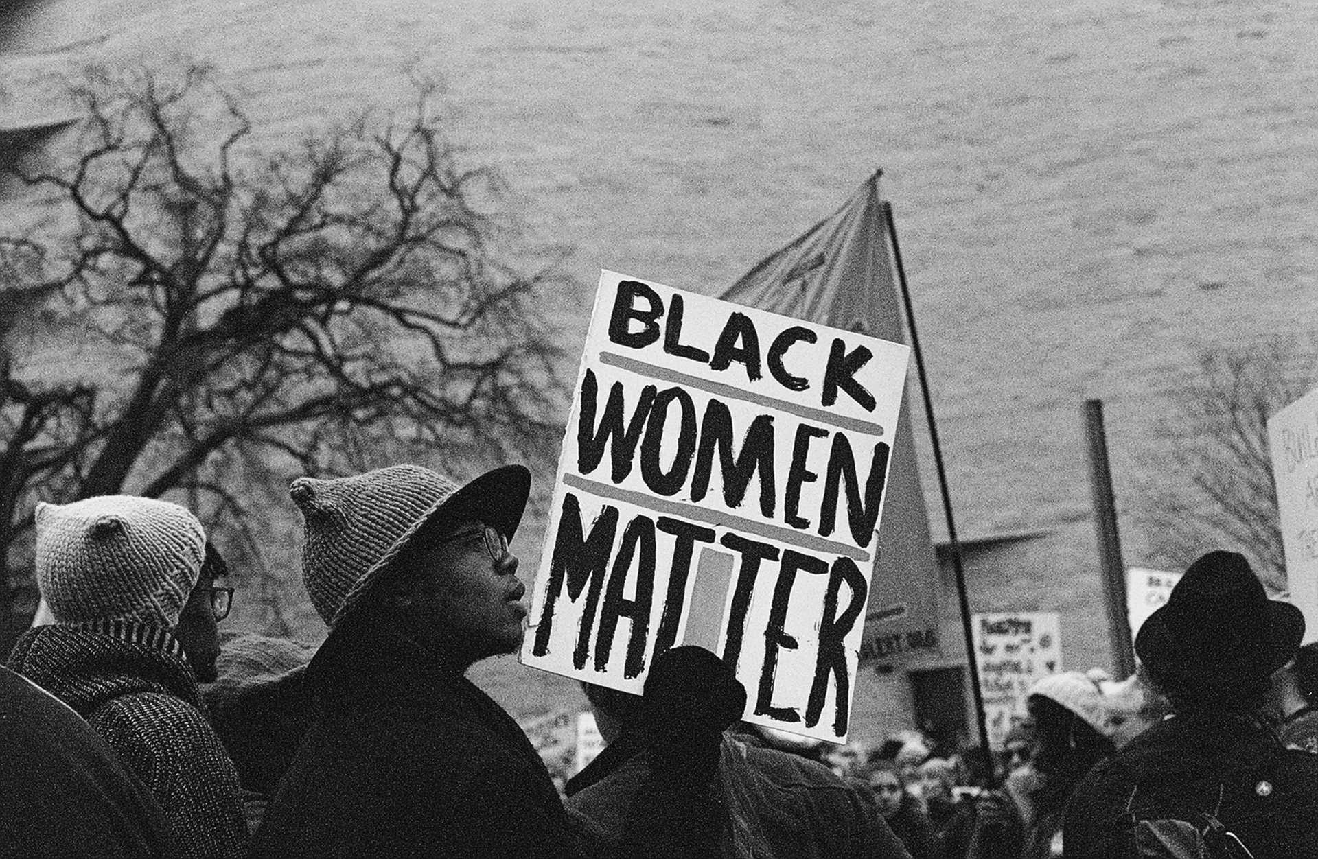 A black and white digital image of marchers at the Women's March in Washington, DC on January 21, 2017.