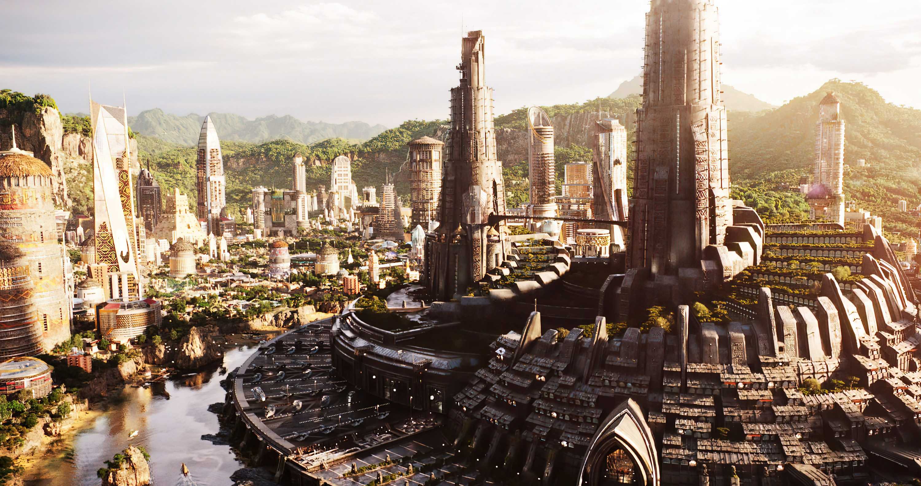 An ariel view of the city of Wakanda with tall buildings nestled in valley of some green mountains.
