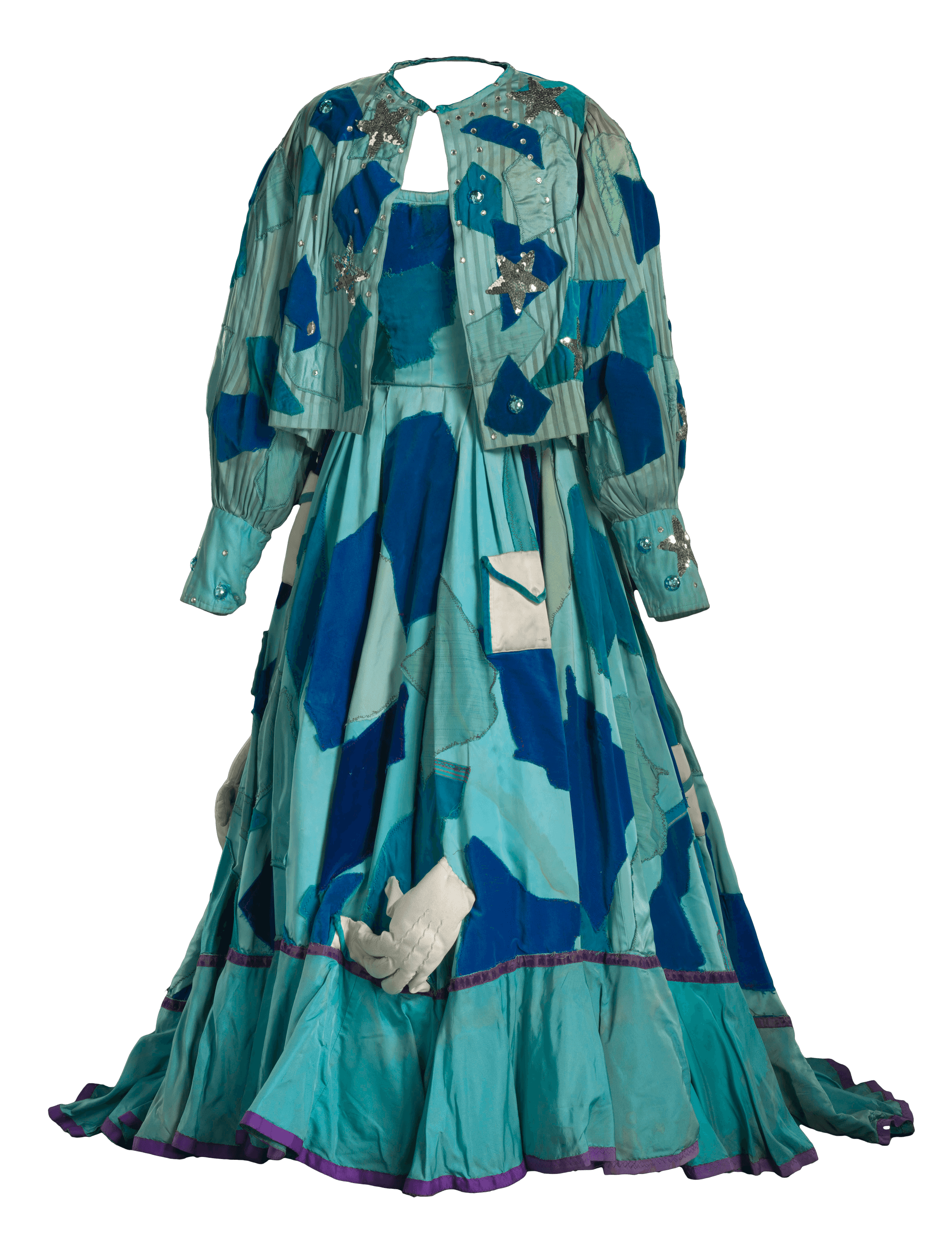 A blue and teal organic shaped, patchwork costume gown, petticoat, and jacket for Addaperle in The Wiz.