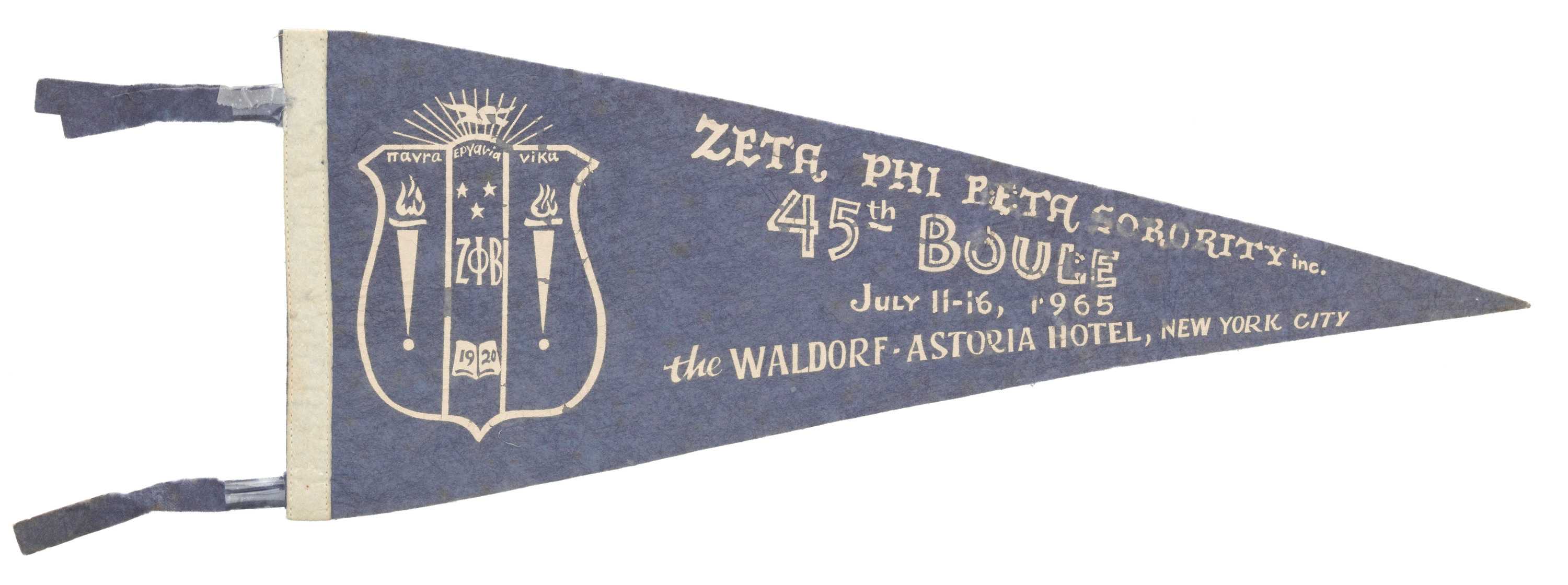 A Zeta Phi Beta Sorority felt pennant. This triangular shaped pennant is a faded royal blue on the front.