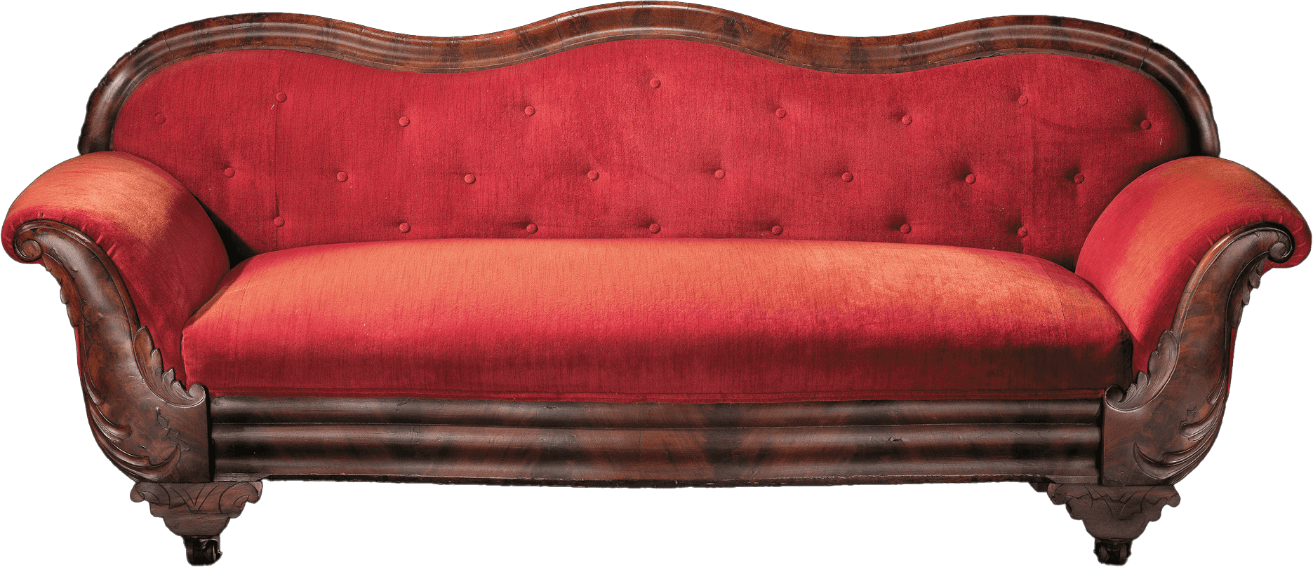 A Late Classical mahogany sofa, upholstered in red, with serpentine, tufted back and wing scroll arms, crotch mahogany decorative veneers on crest, arms, and apron.