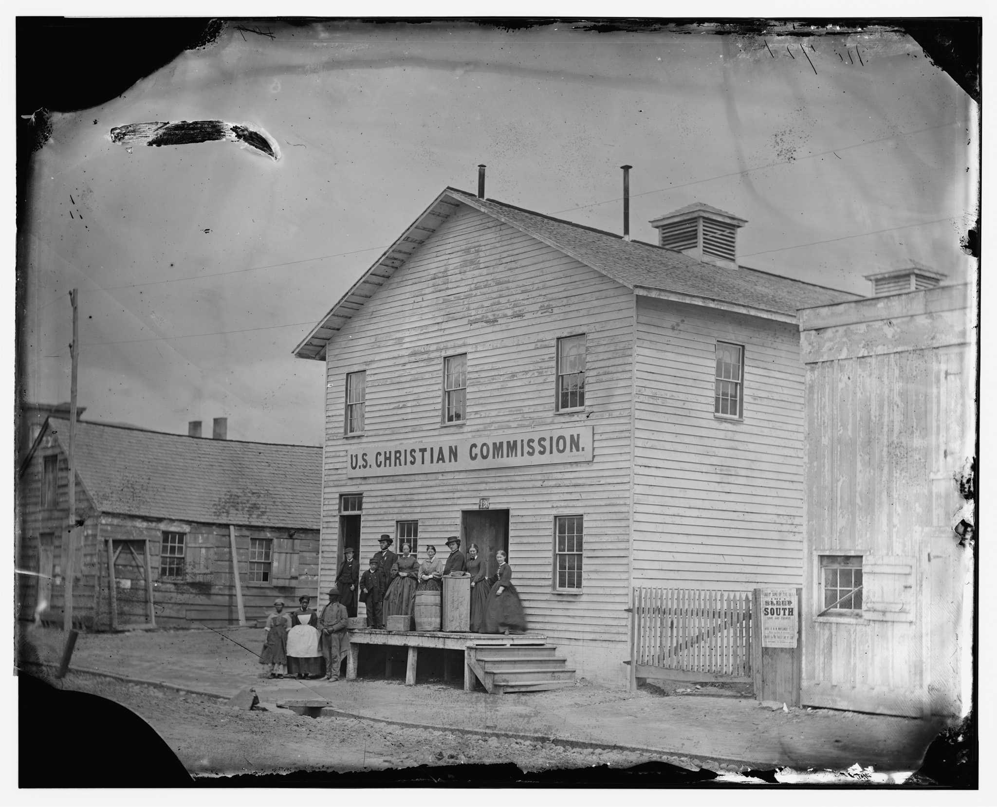 Photograph of women in front of a U.S. Christian Commission building