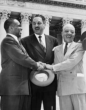 Photograph of NAACP lawyers congratulating one another