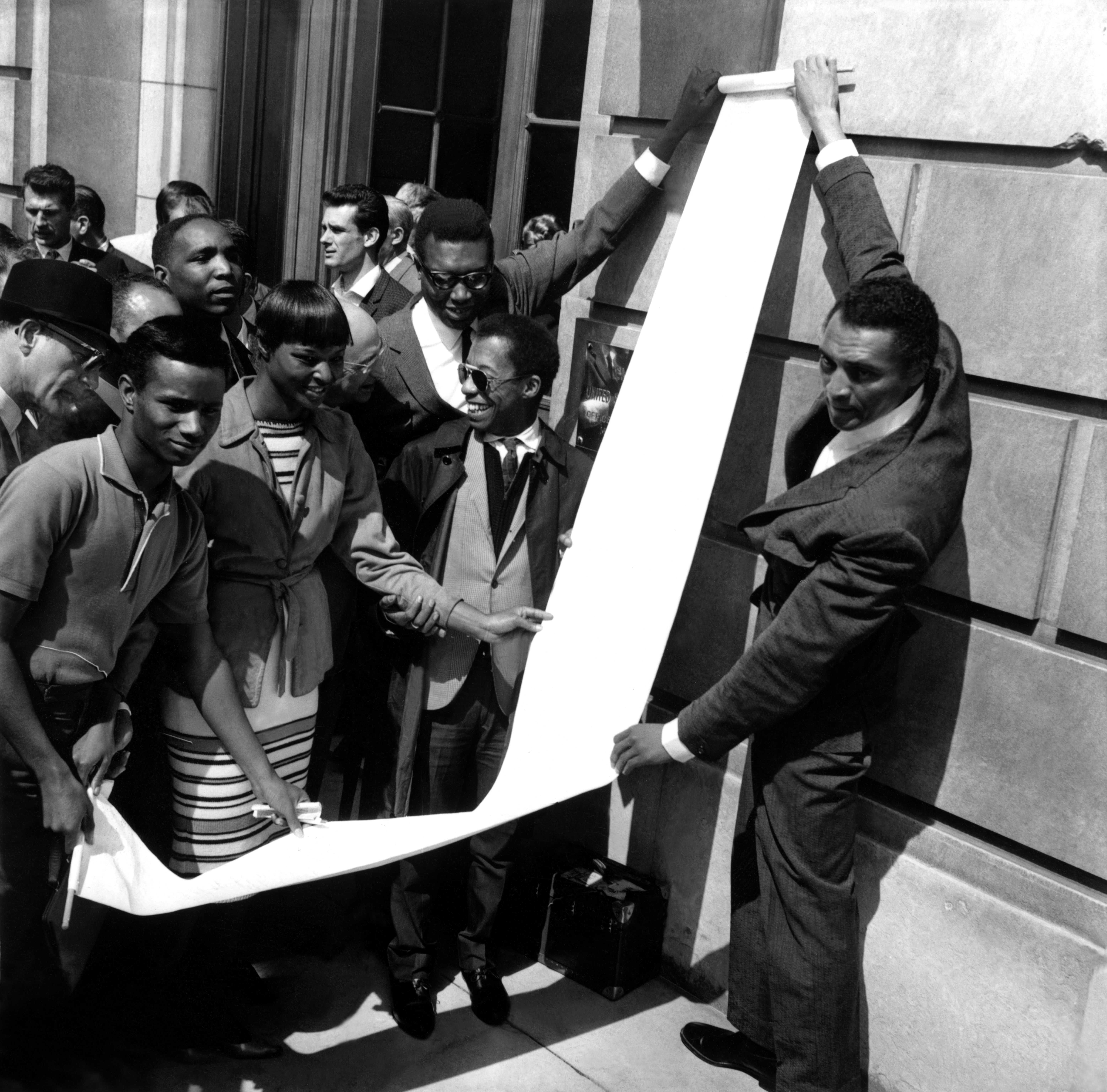 Photograph of James Baldwin delivering Petition, U.S. Embassy, Paris