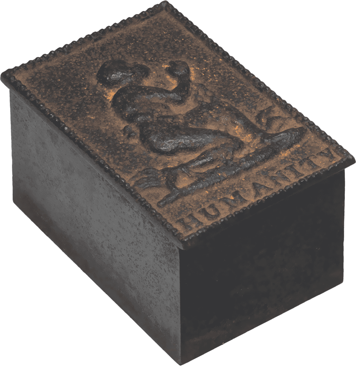 Cast iron desk box, holding a weighted roller blotter. The box bears an embossed representation of a man kneeling in chains, a famous design by Josiah Wedgewood for the English & Foreign Anti-Slavery Society. The single word "HUMANITY" appears below the figure and a raised, decorative border is around the edge. The box contains a brass topped iron piece with a slightly curved bottom.