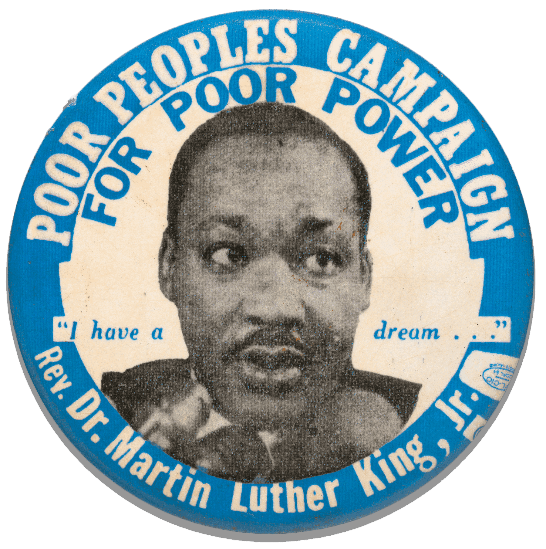 A round pinback button featuring a black and white portrait of Dr. Martin Luther King Jr. in the center. Printed above and around in white text on blue background is [POOR PEOPLES CAMPAIGN], directly below in blue text on white background is [FOR POOR POWER]. In the center, divided by the portrait are the words ["I have a dream..."] in blue text. Below the portrait, in white text on blue background is [Rev. Dr. Martin Luther King, Jr.], followed by a union printer's symbol.
