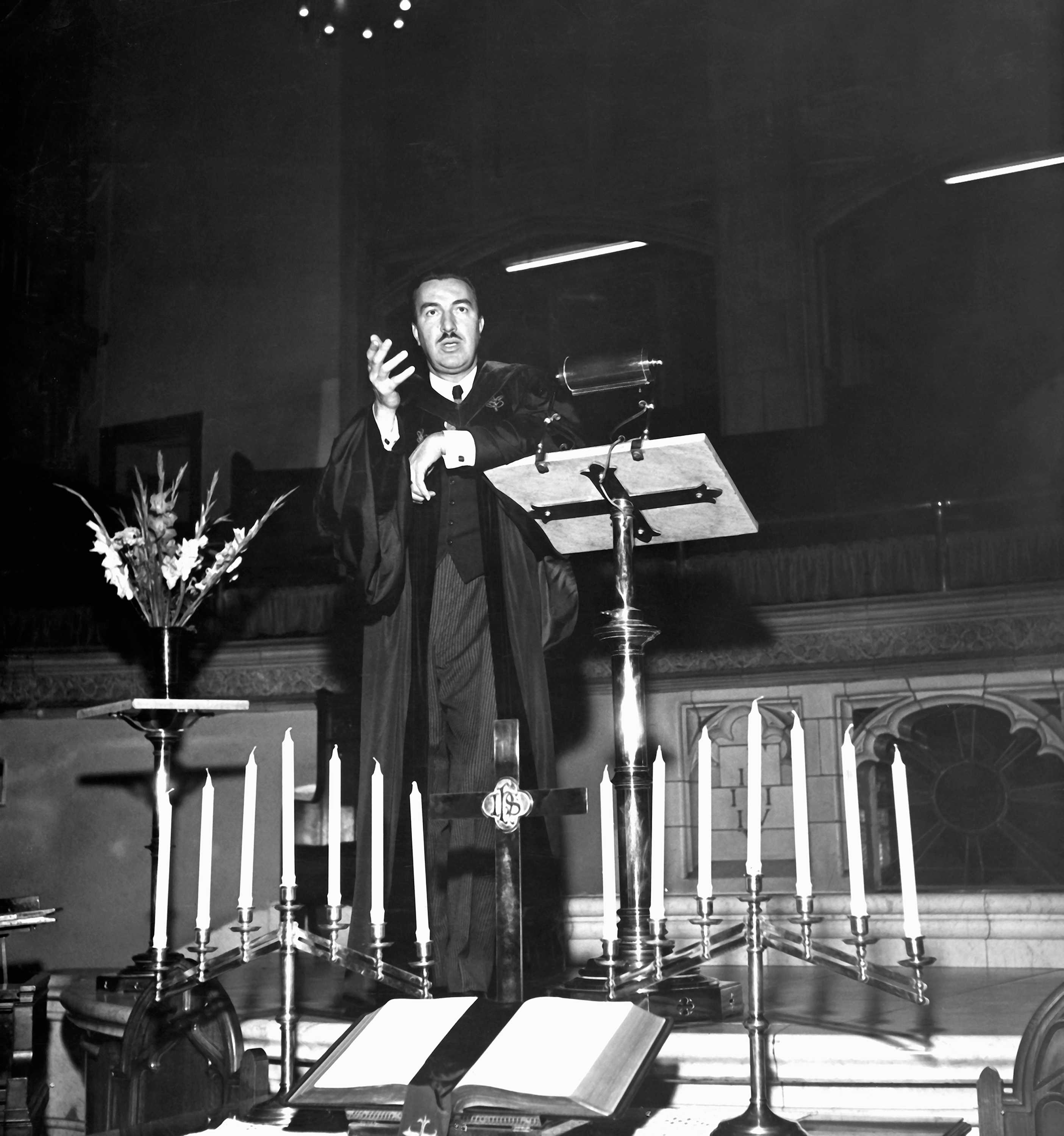 Black and white photograph of Rev. Adam Clayton Powell Jr. addressing his congregation