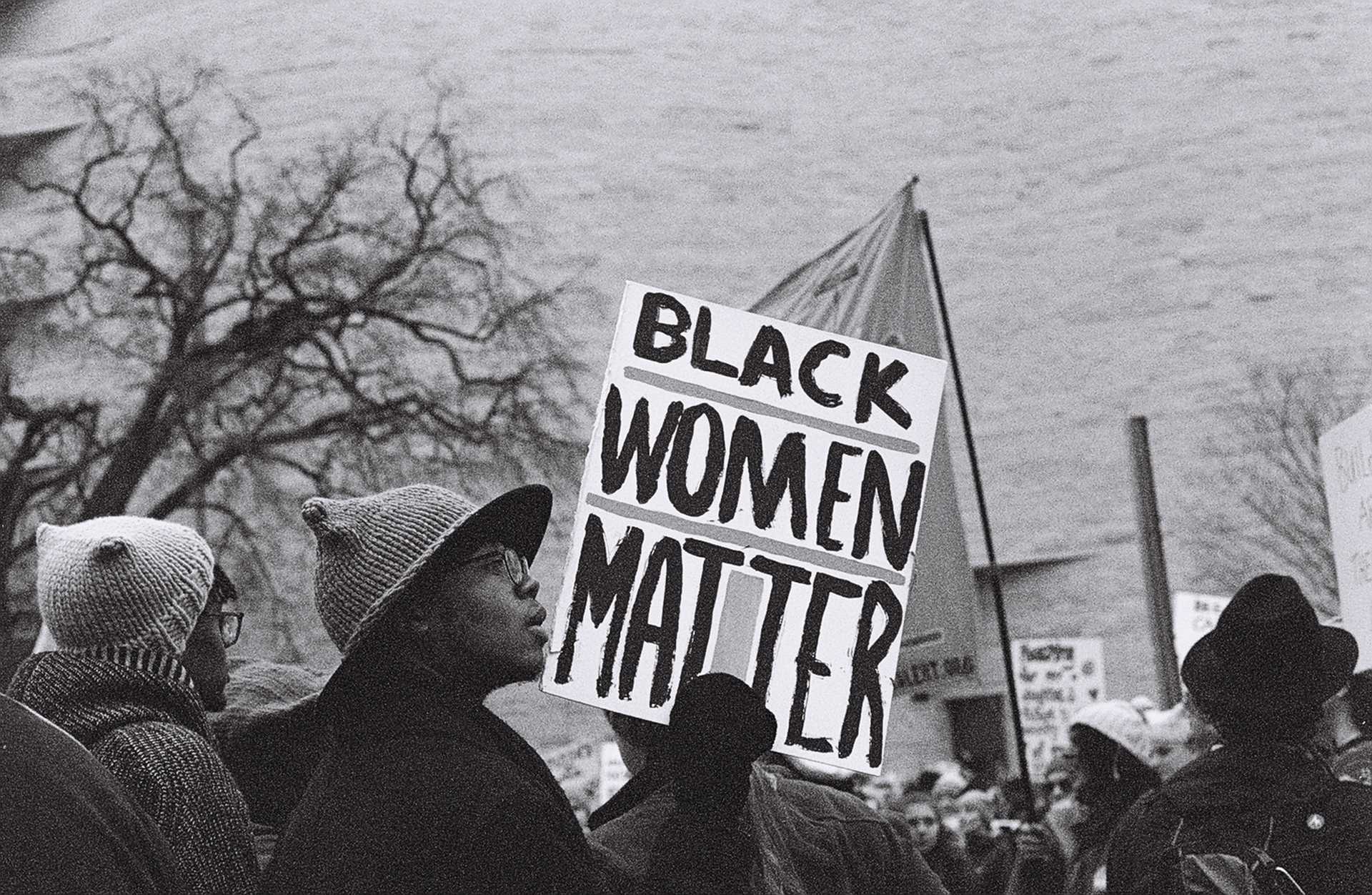 A black and white digital image of marchers at the Women's March in Washington, DC on January 21, 2017.