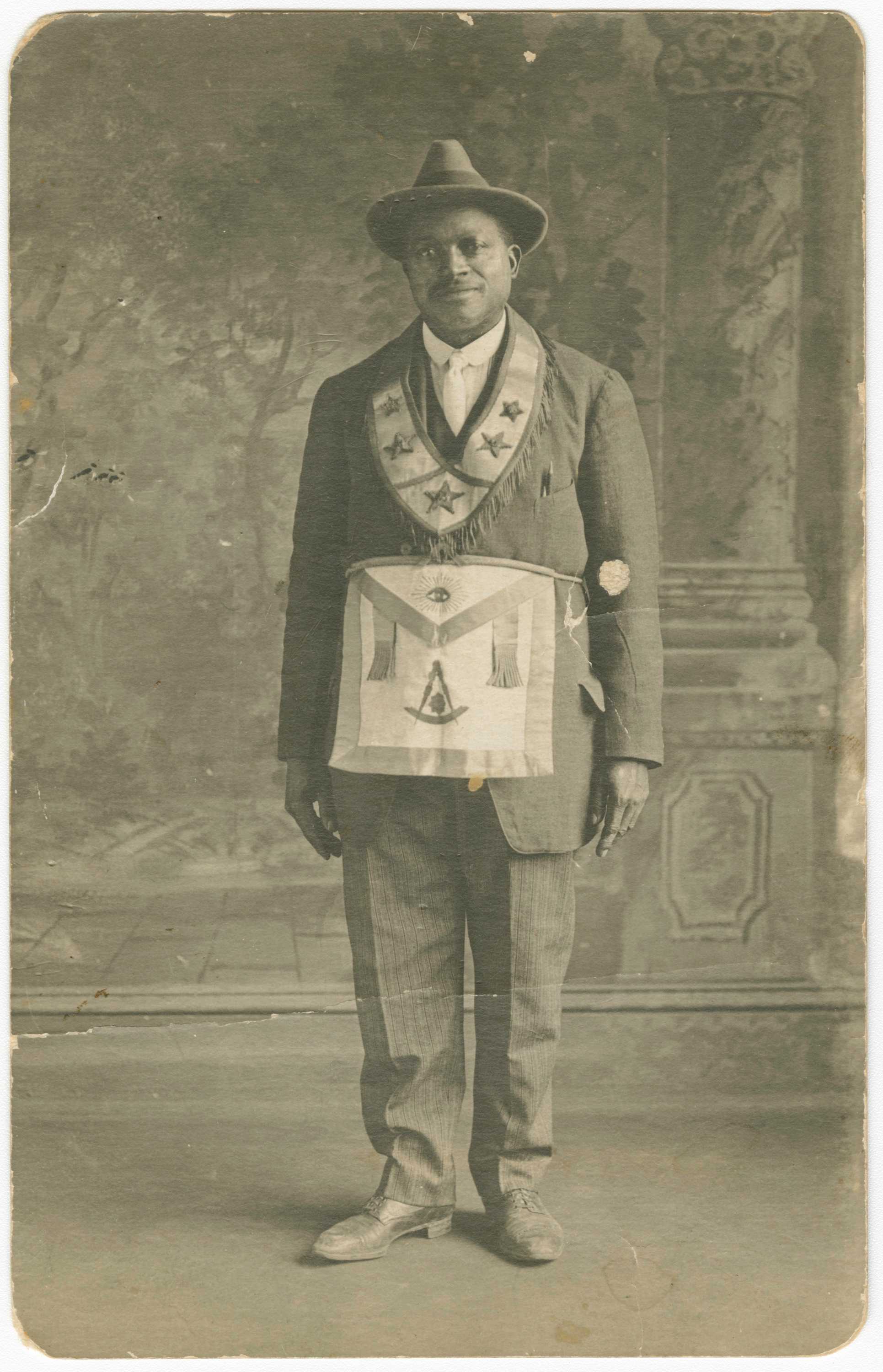 Black and white photographic postcard of Daniel Hendricks wearing Masonic apron and collar.