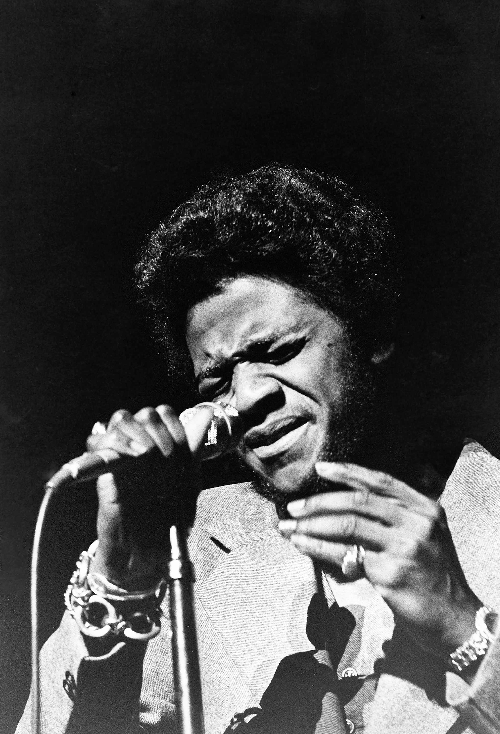 Photograph of Al Green with a microphone in his hand
