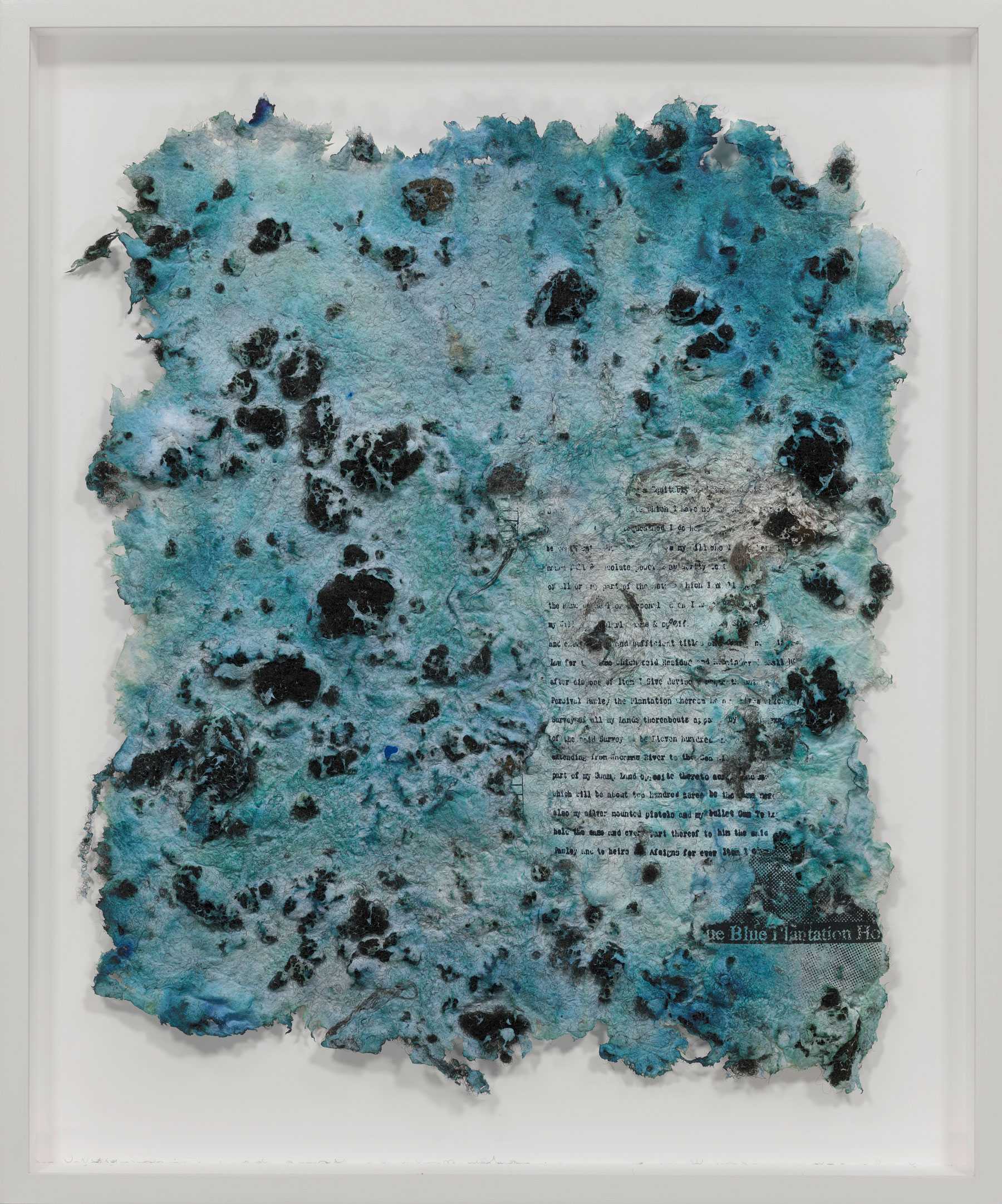 A textured paper artwork with blue and black spots and faint text visible, depicting a layered, abstract design.