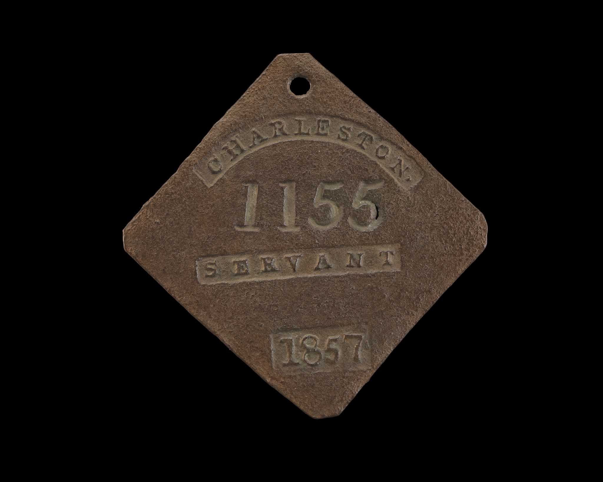 Photograph of square slave badge