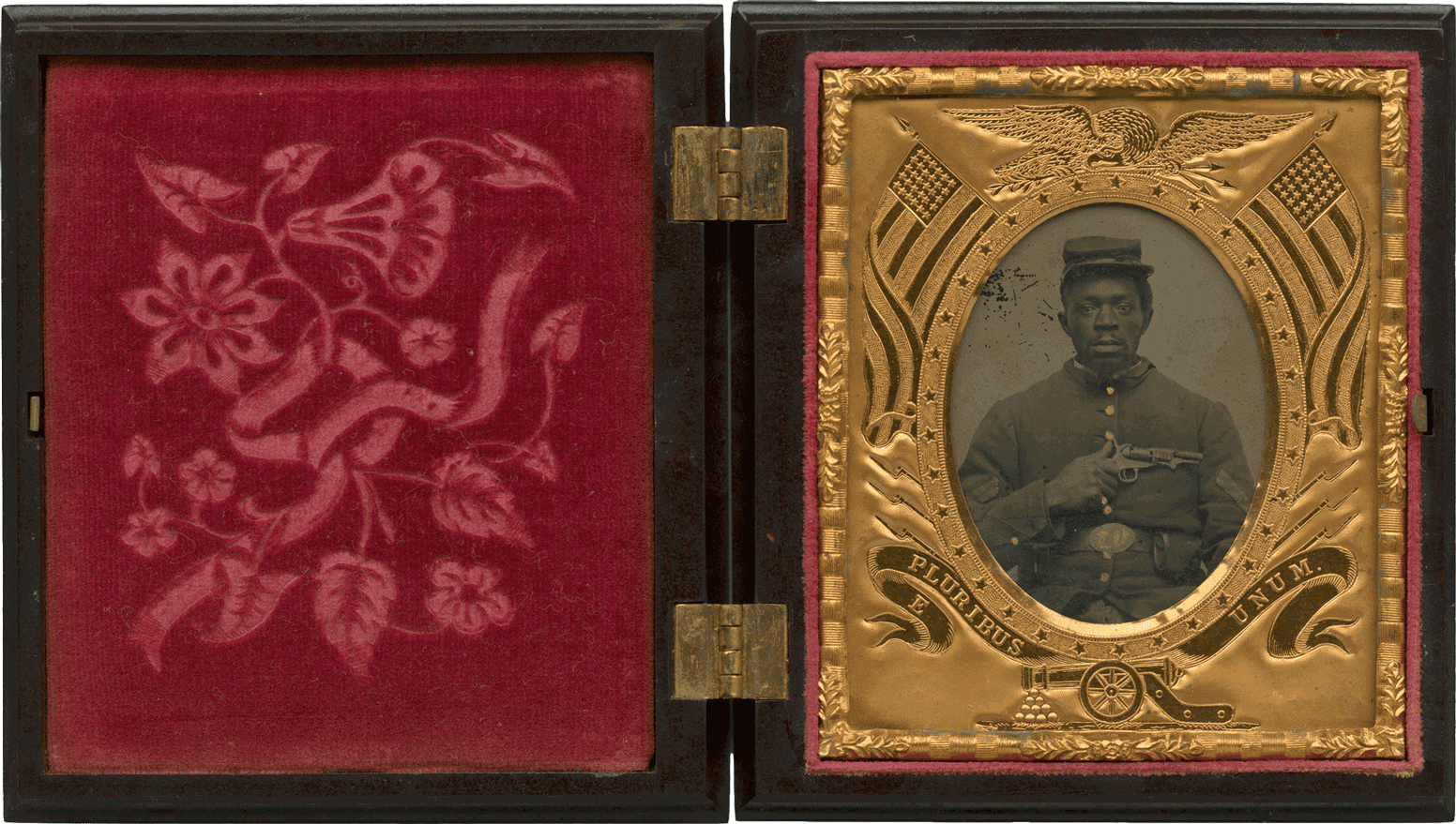 A tintype of a soldier with his portrait on the right hand side and a red velvet flower pattern on the right.