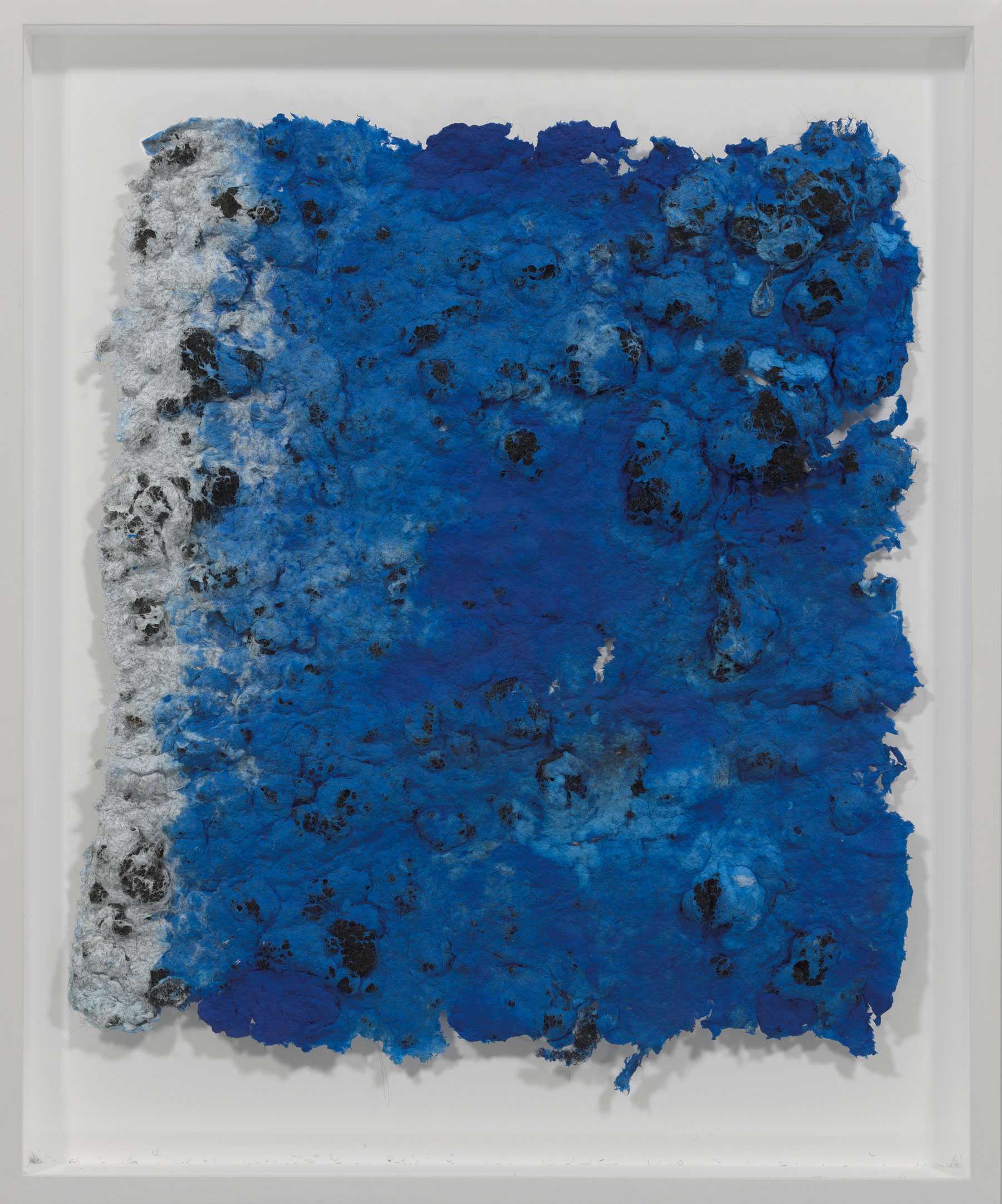 Textured artwork in shades of blue and white with black spots on a square canvas.