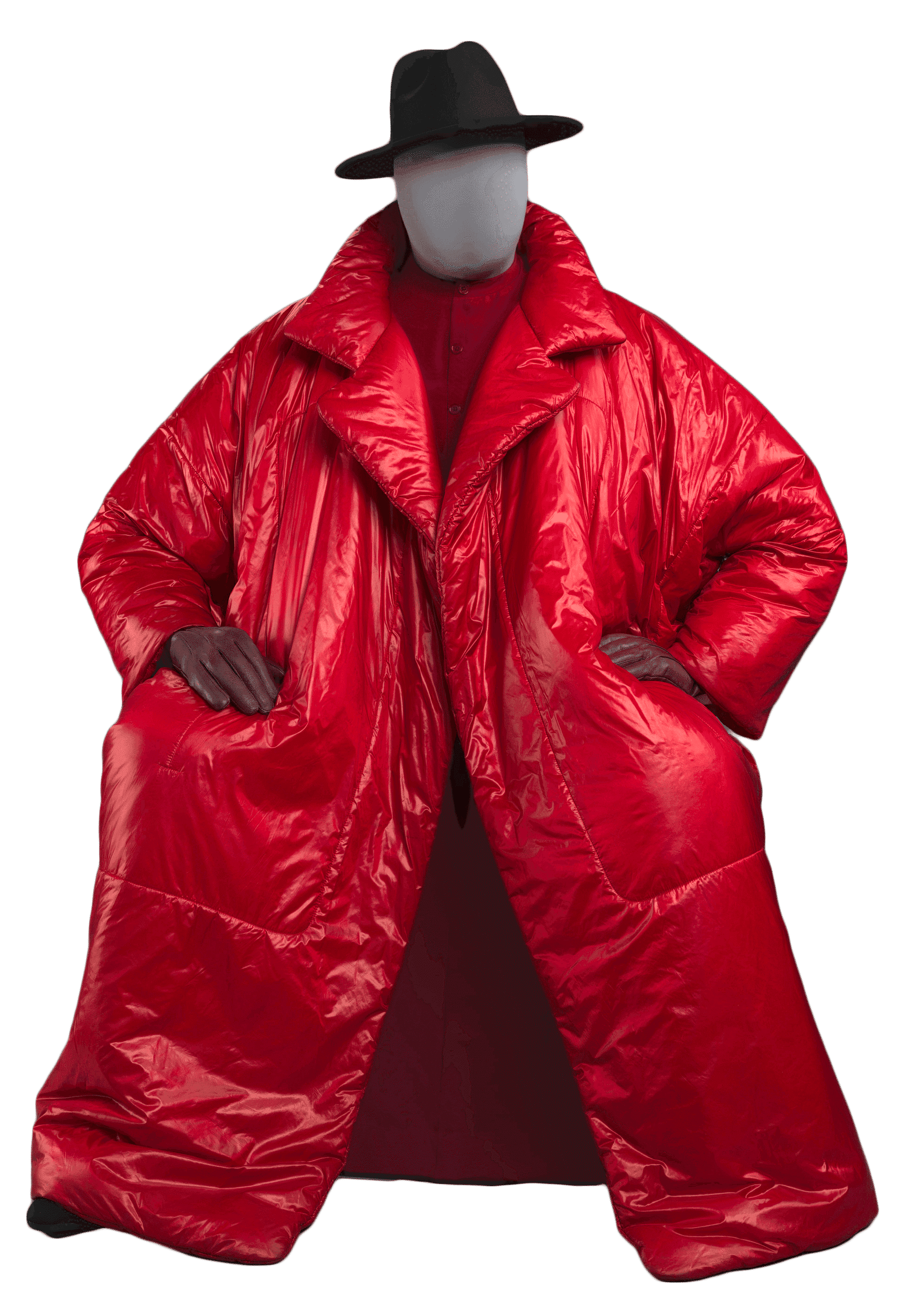 Large red puffer coat place displayed on a mannequin with a black rimmed hat.