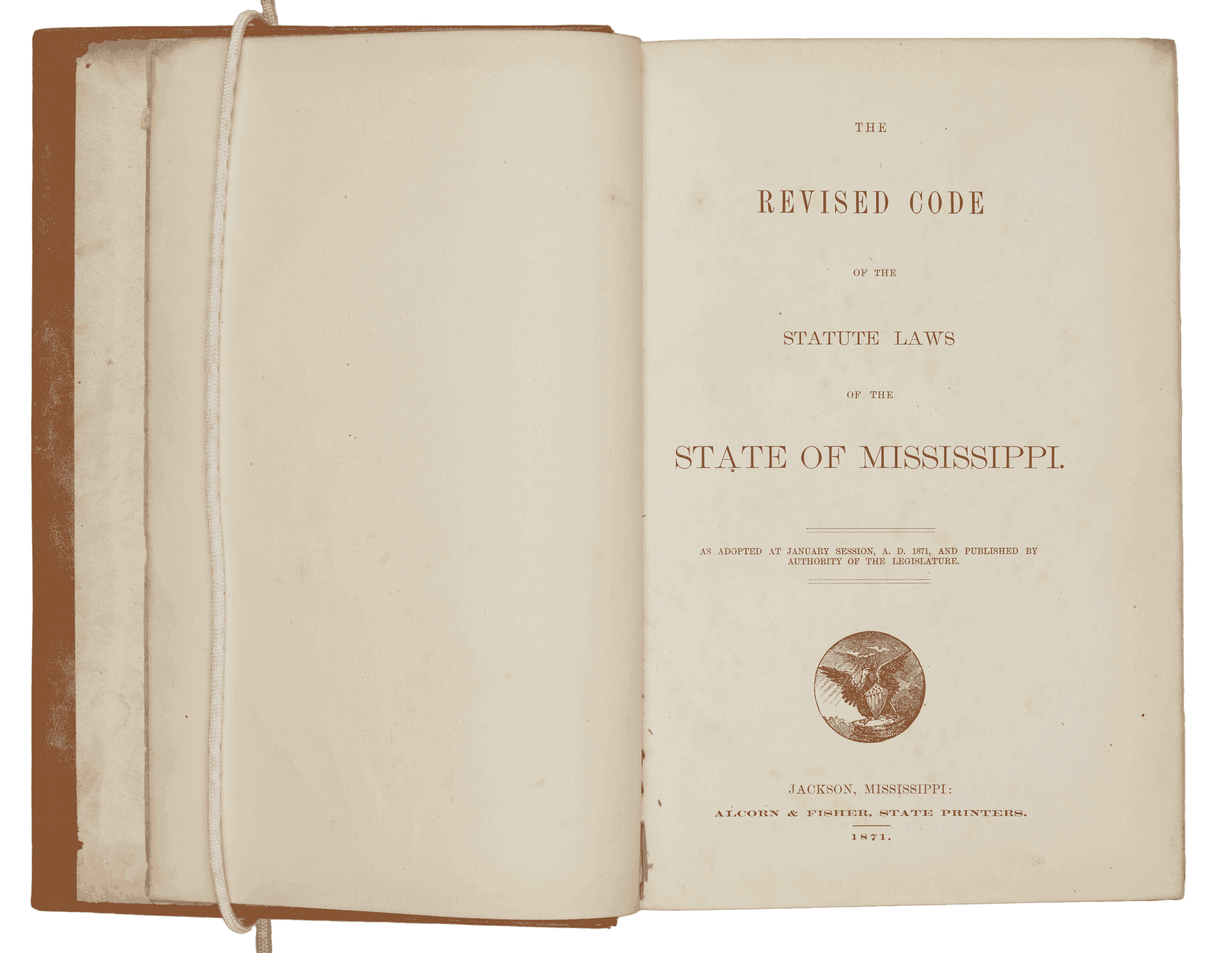 The Revised Code of Mississippi is opened to its title page. With the title, it has a small emblem.