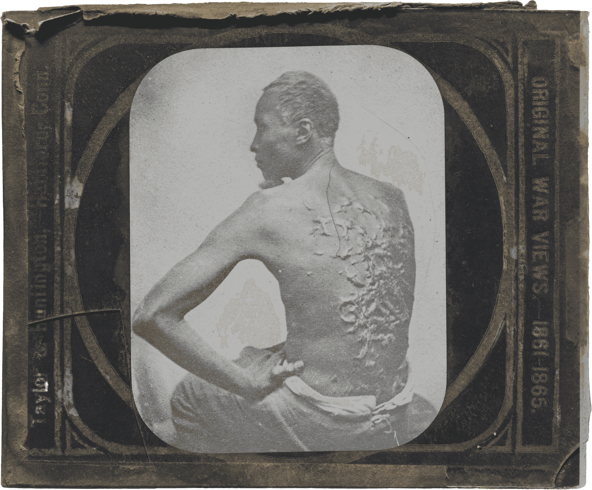 A glass plate photographic "magic lantern" slide depicting the bare back of an enslaved man with multiple raised scars. The slide has a black and gold paper sleeve and is in a plain wooden slide mount. There is a short crack in the lower left corner of the upper glass plate. The image depicts a man, often identified as "Gordon," or "Private Gordon," and sometimes as "Peter," seated with his shirtless back to the camera. His proper left hand is on his left hip, his elbow extended, and his face is turned to the left. Along the right side of the sleeve is printed [ORIGINAL WAR VIEWS - 1861-1865]  and on the left is [Taylor & Huntington - Hartford, Conn.].