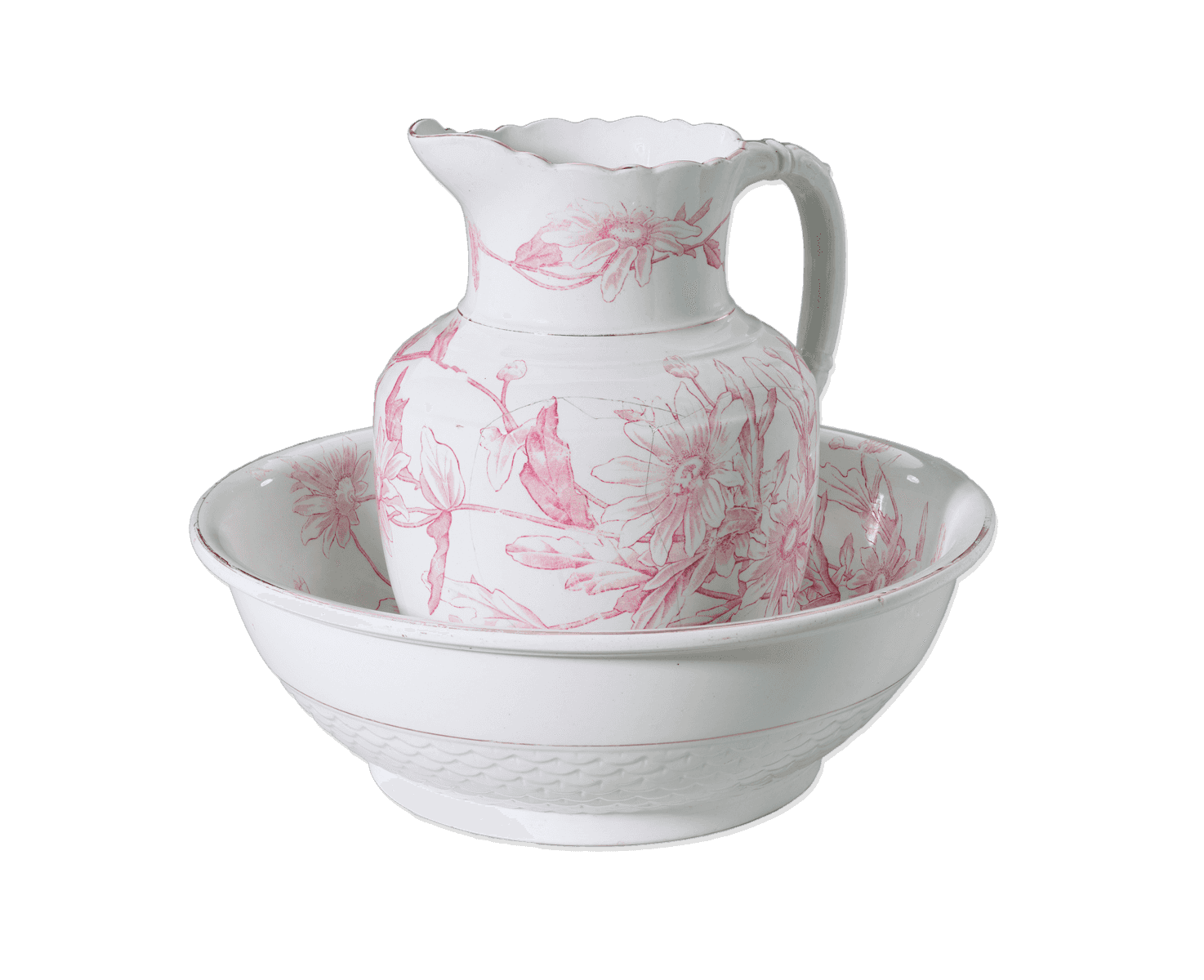 White ceramic pitcher and wash bowl set with a dcorative pink floral design.