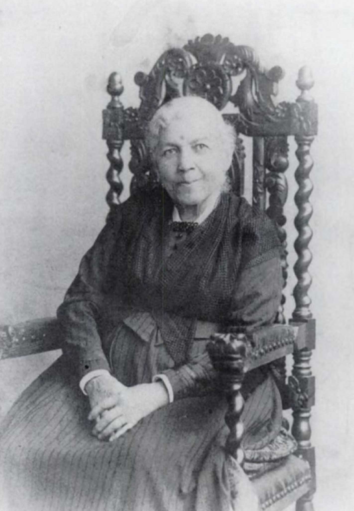 Photograph of Harriet Jacobs sitting in a large wooden chair