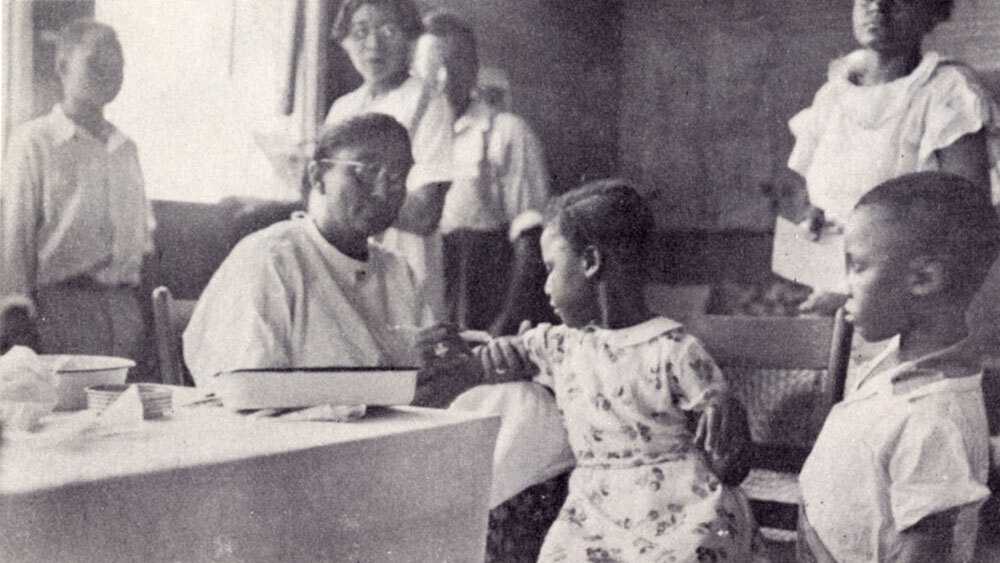 Photograph of AKA’s volunteer medical team immunizes children against diphtheria