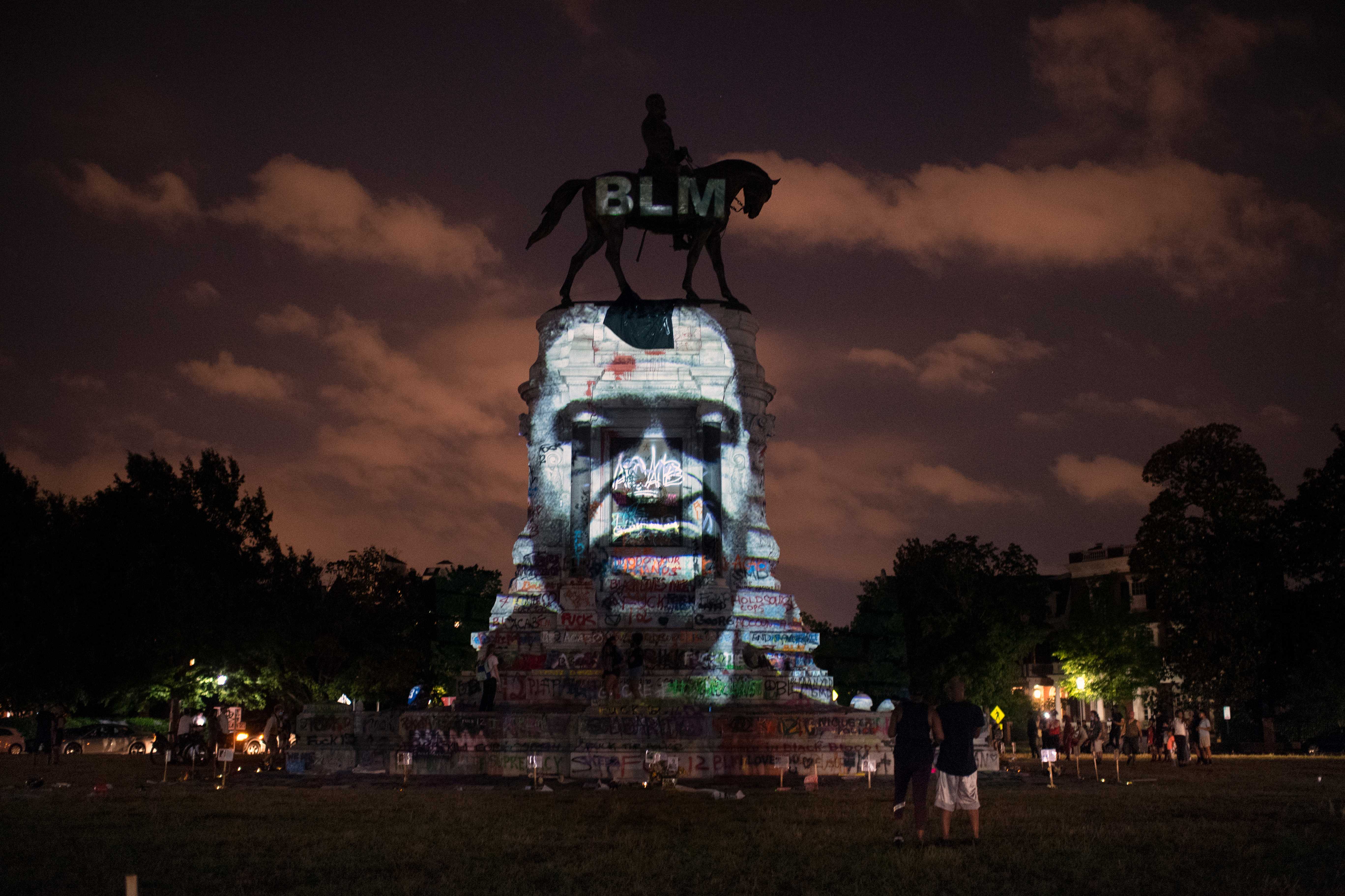 Color photograph of Roberts E. Lee Statue with the face of George Floyd superimposed on it.