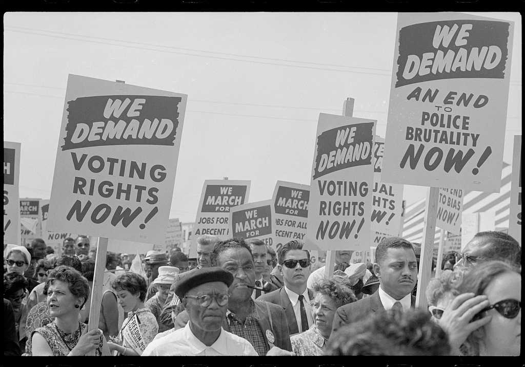 Photograph of protesters with signs