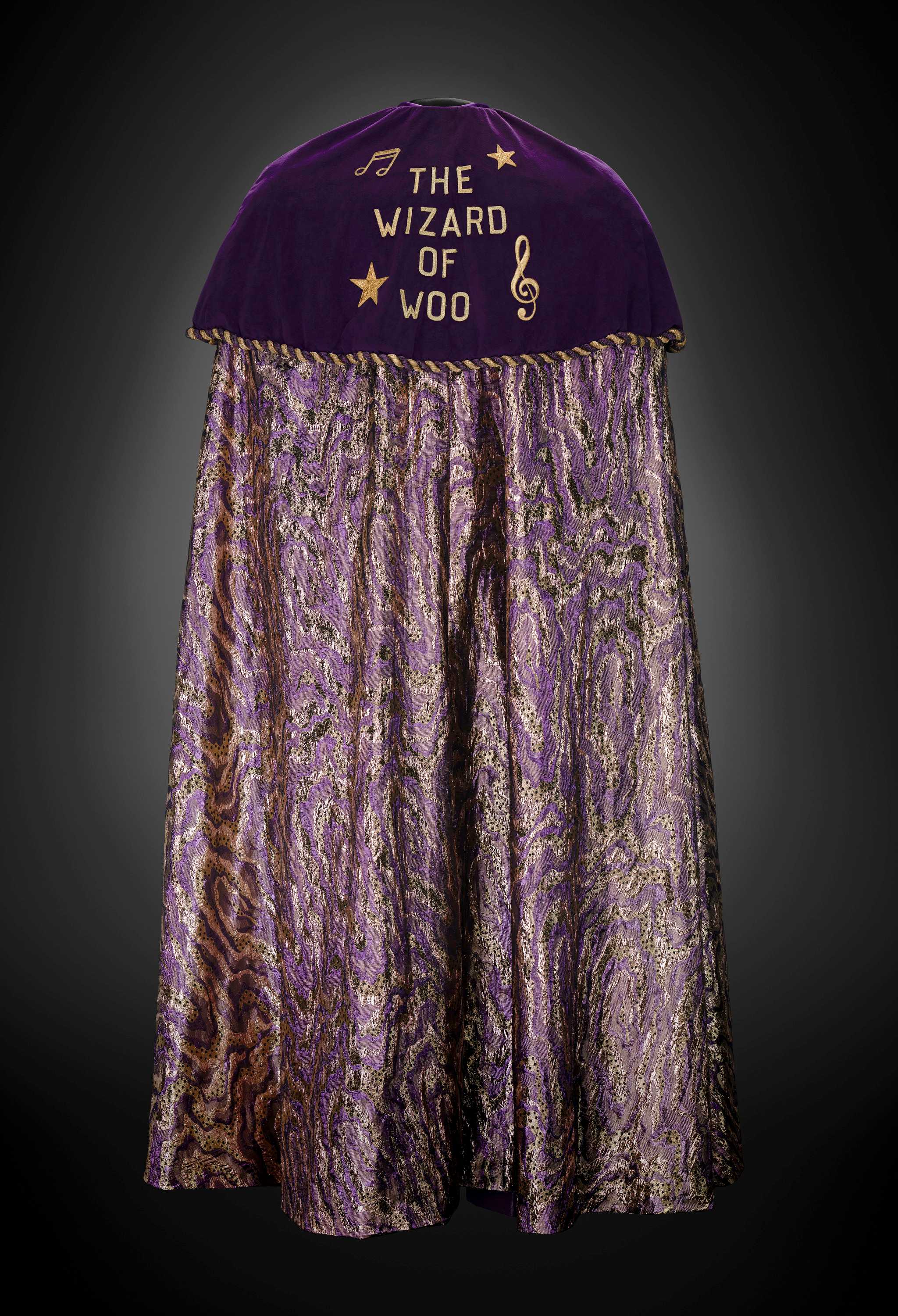 Bernie Worrell's purple cape adorned with 'The Wizard of Woo' on the top half and a purple pattern below.