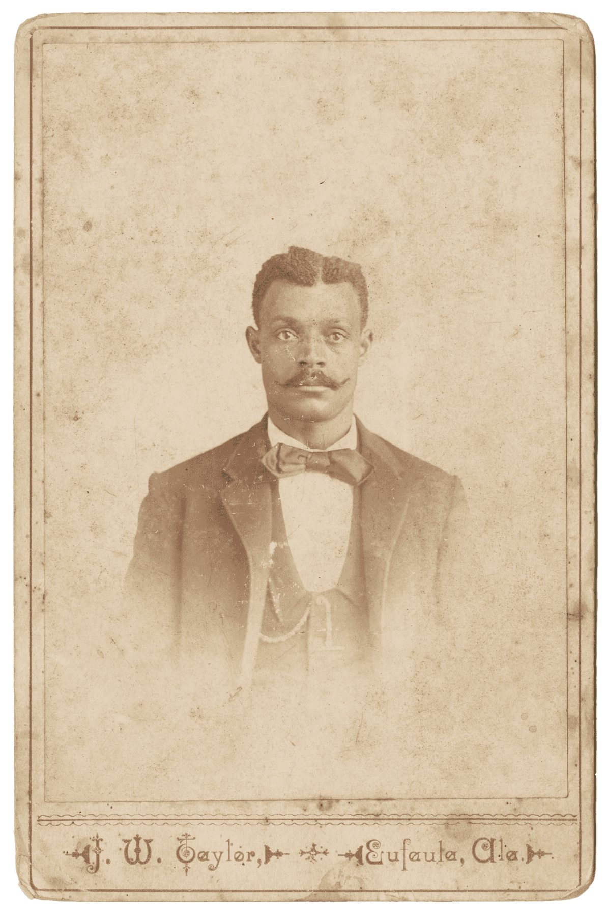 Black and white cabinet card of a man. Text on the card reads “J. W. Taylor, Eufaula, Ala.”