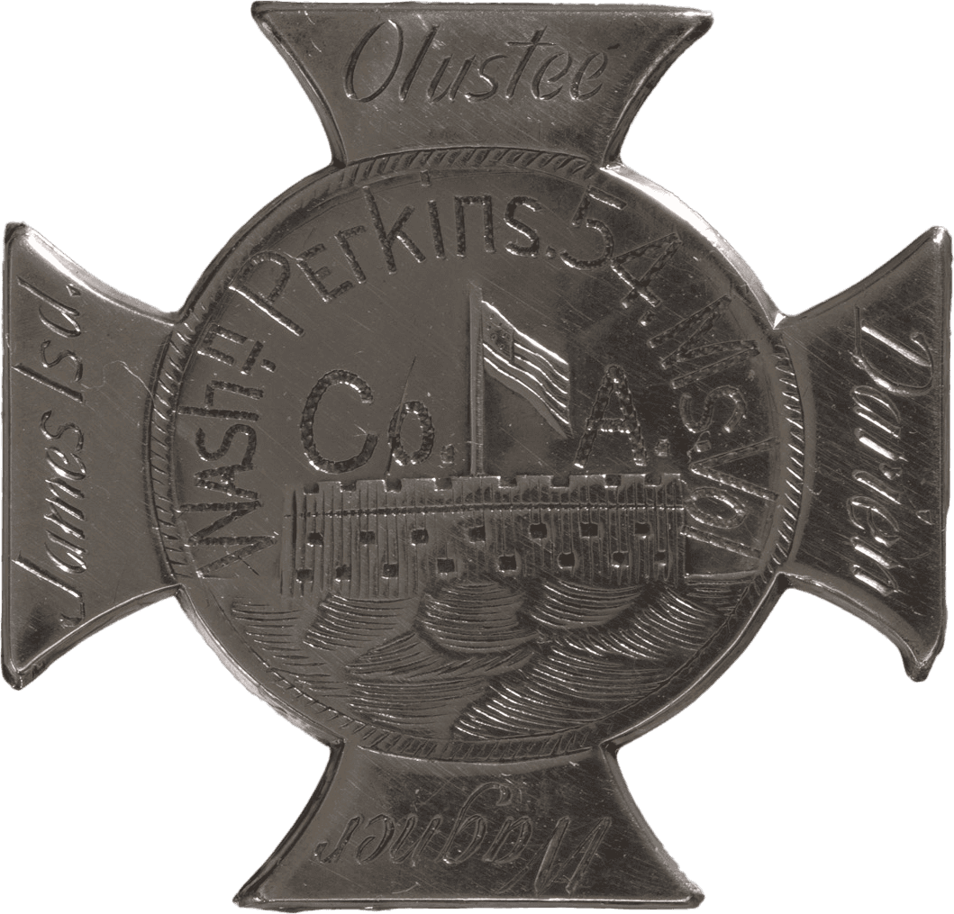 A Maltese cross with a disk at center showing Fort Sumter flying an American flag overhead in raised relief with water in the foreground. The owner’s name [Washnt Perkins 54 Ms. Vol / Co. A] is centered over the fort etched in a half-circle. Each of the arms of the cross is hand engraved with a battle fought by the 54th Massachusetts Infantry — (clockwise from top) Olustee, Darien, Wagner, and James Isd — done in different lettering than the owner’s name. The back of the badge has a T-bar pin closure.