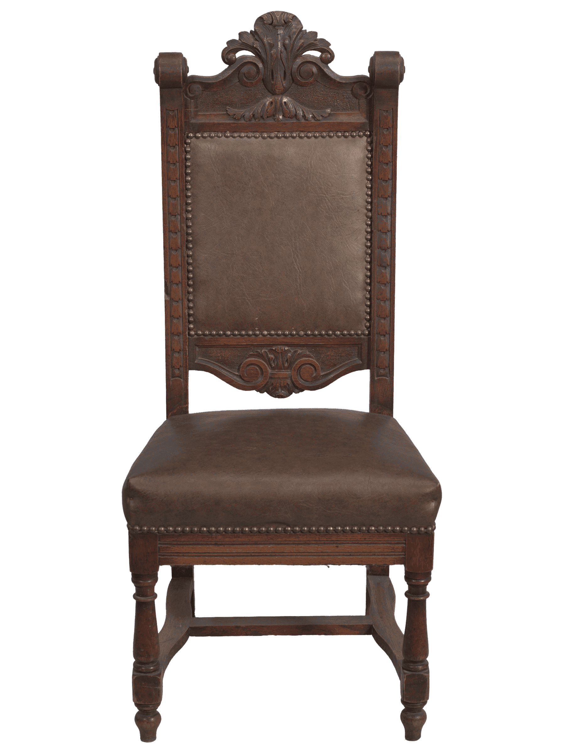 A wood pulpit chair with a dark finish. The chair has four legs with the rear legs extending the full height of the seat back. The front legs are turned with varying geometric shapes and are topped with the seat. Connecting the front legs to the back legs are two curved stretcher bars. Between the two stretcher bars is an additional support bar. The seat cushion and chair back are padded with faux-leather covers. The covers are adhered by metal studs. The chair back features a line of stylized foliage carved on the front of either side of the uprights. The uprights of the chair back are capped with scrolls. The center of the top rail of the chair features large, carved acanthus leaves in the center with scrollwork extending down either side. The bottom rail of the chair back features a similar but smaller design of acanthus leaves and scrollwork.