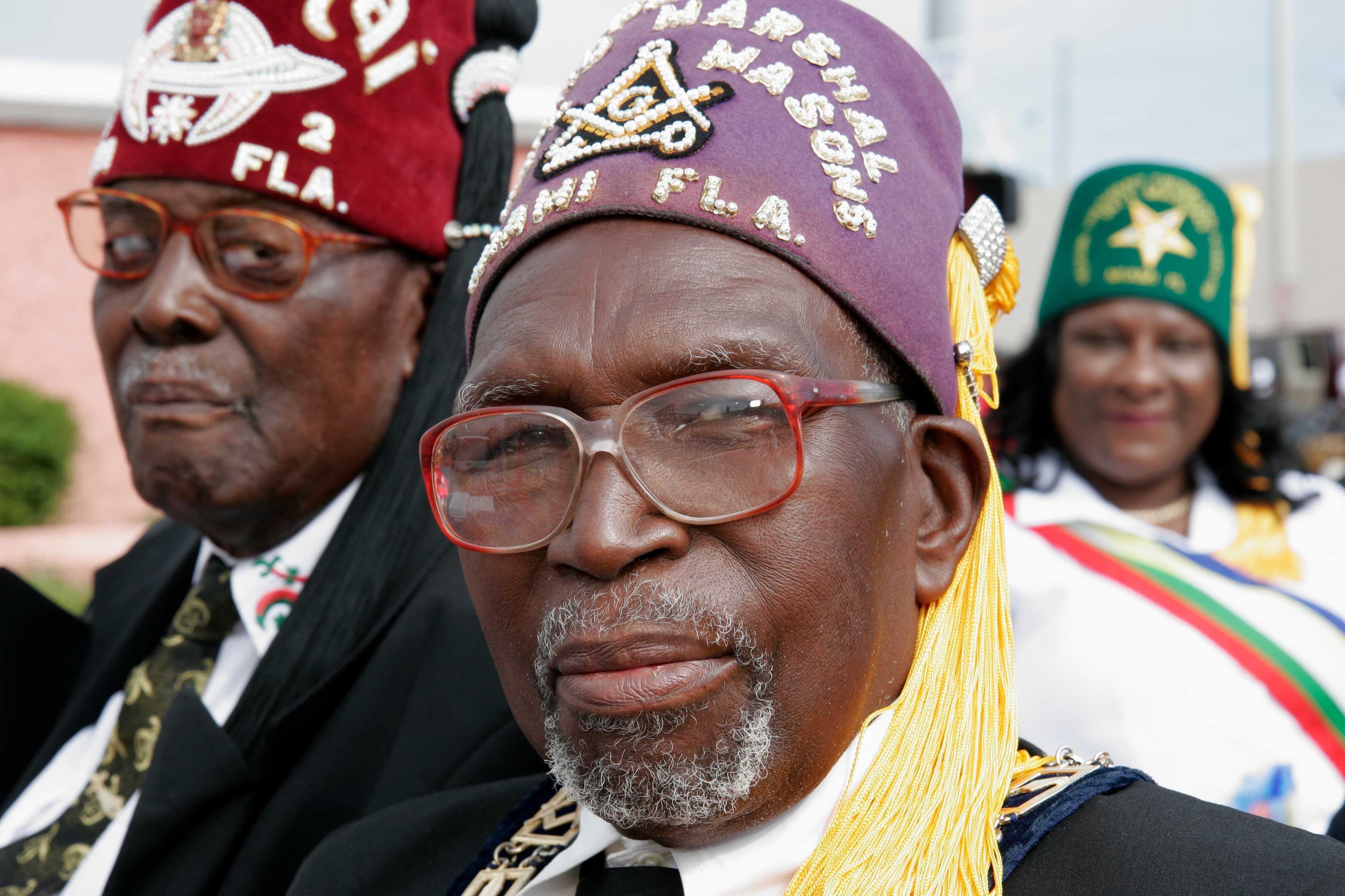 Photograph of Black senior men wearing Masons, masonic lodge fez caps at the Martin Luther King Junior Parade