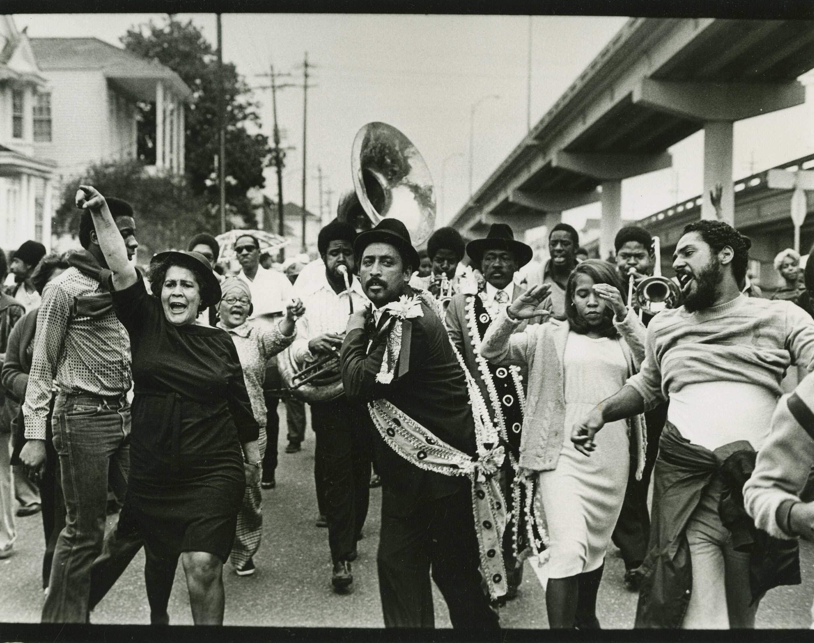 Black and white photograph of jazz funeral in New Orleans.