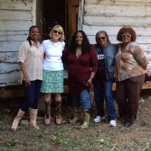 Photograph of Gretchen Smith, Arlene Estevez, Theresa Hilliard, and their cousins at the cabin
