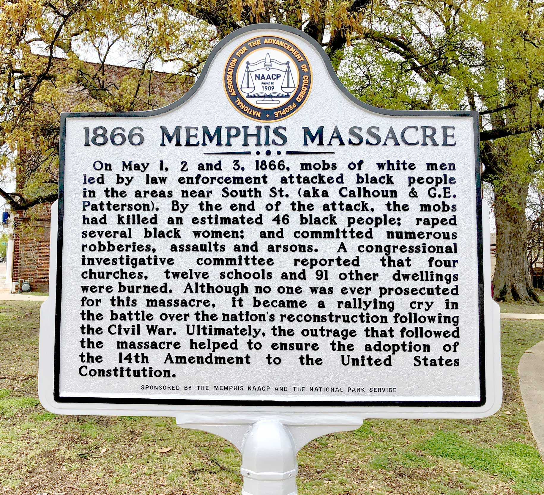 A picture of the historical street sign plaque marking the spot of the 1866 Memphis Massacre.