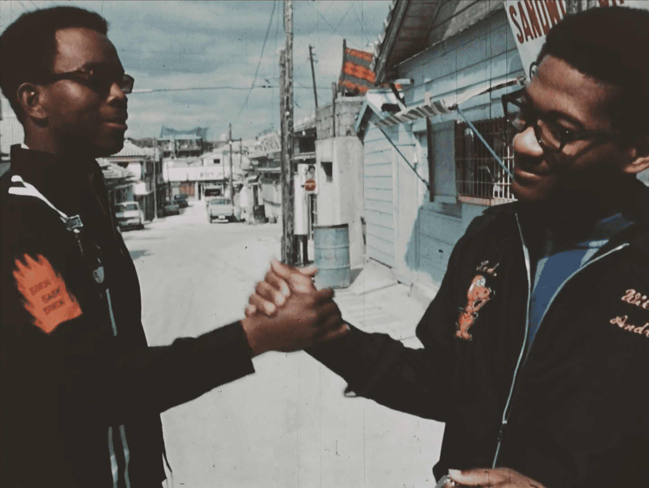 Two men shaking each other hands in a friendly and casual way.