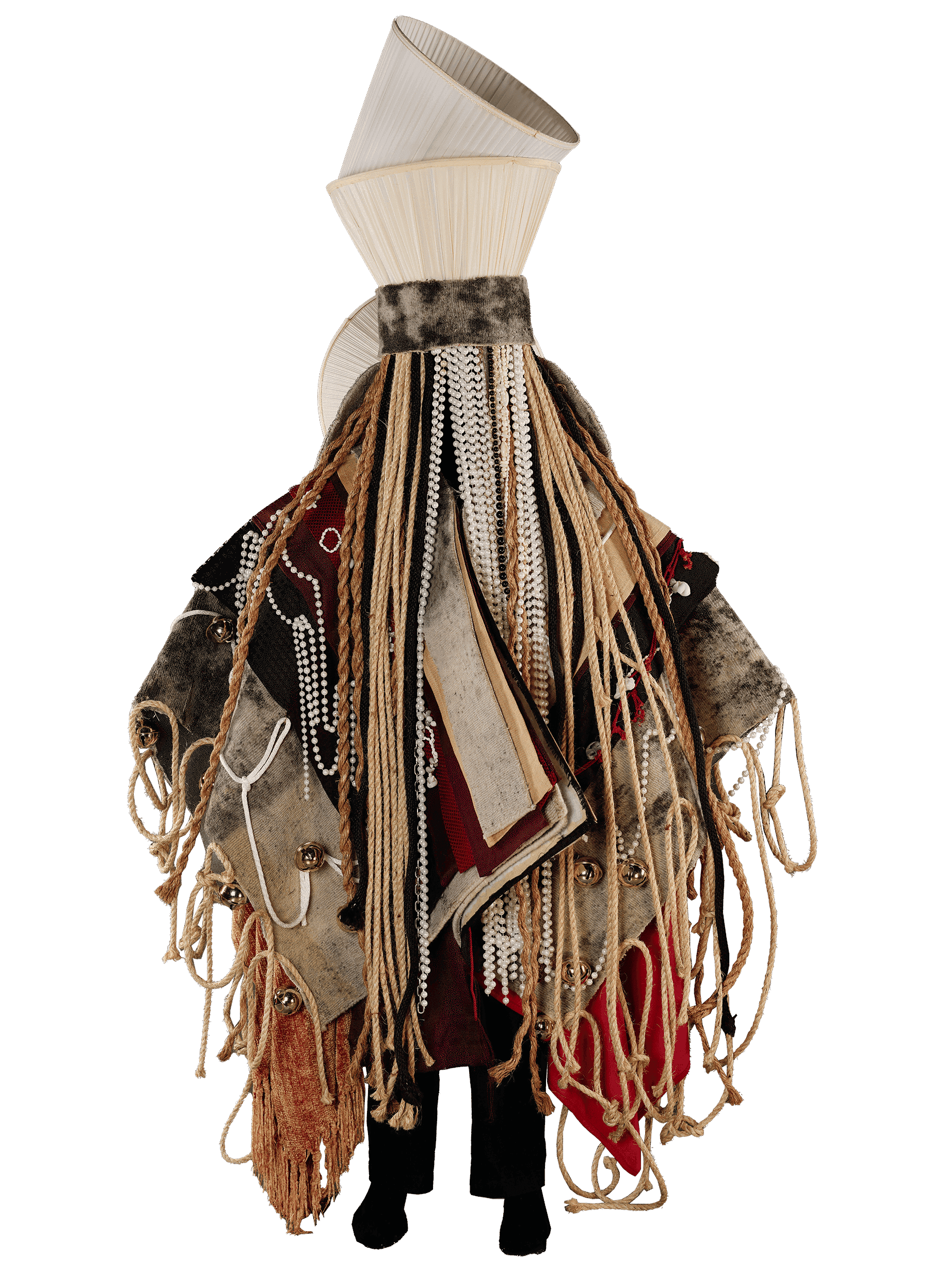 A piece of artwork consisting of different textiles including ropes, beads, and lampshades.