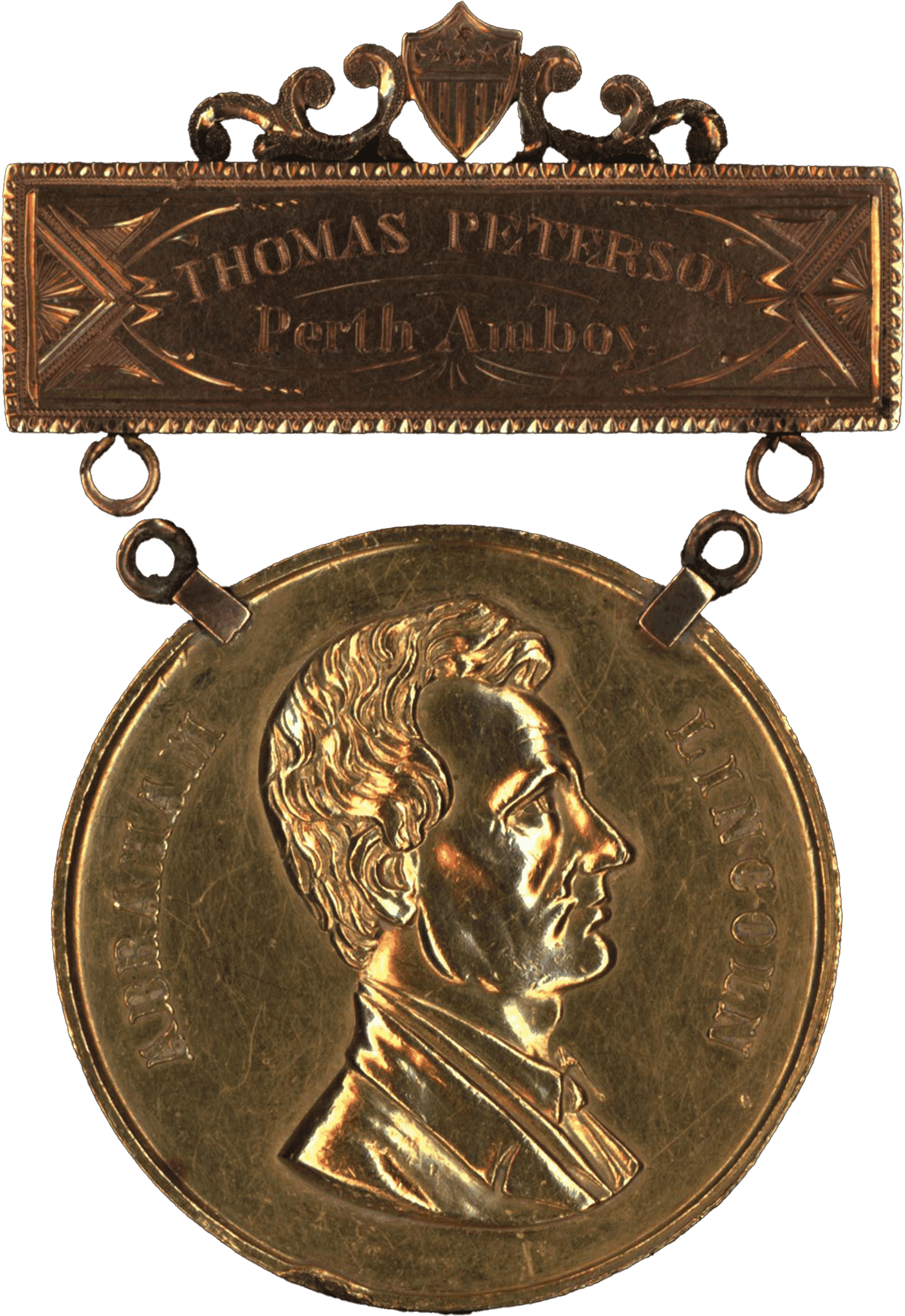 Gold medal embossed with the profile of Thomas Mundy Peterson.  The medal dangles from a gold bar engraved with " Thomas Peterson, Perth Amboy"